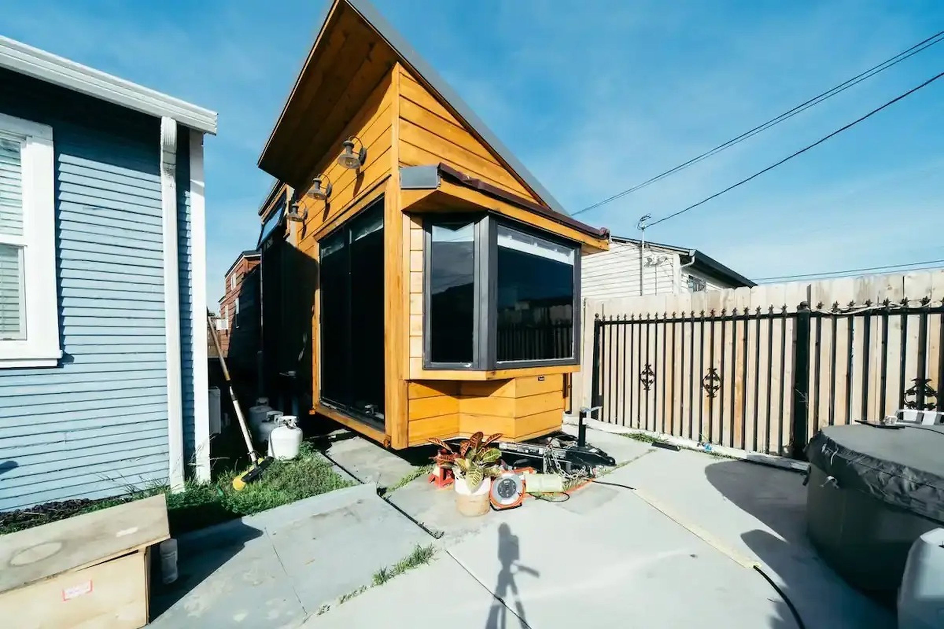 Ansel Troy's wooden tiny home on a patio outside of his home in Oakland, California.