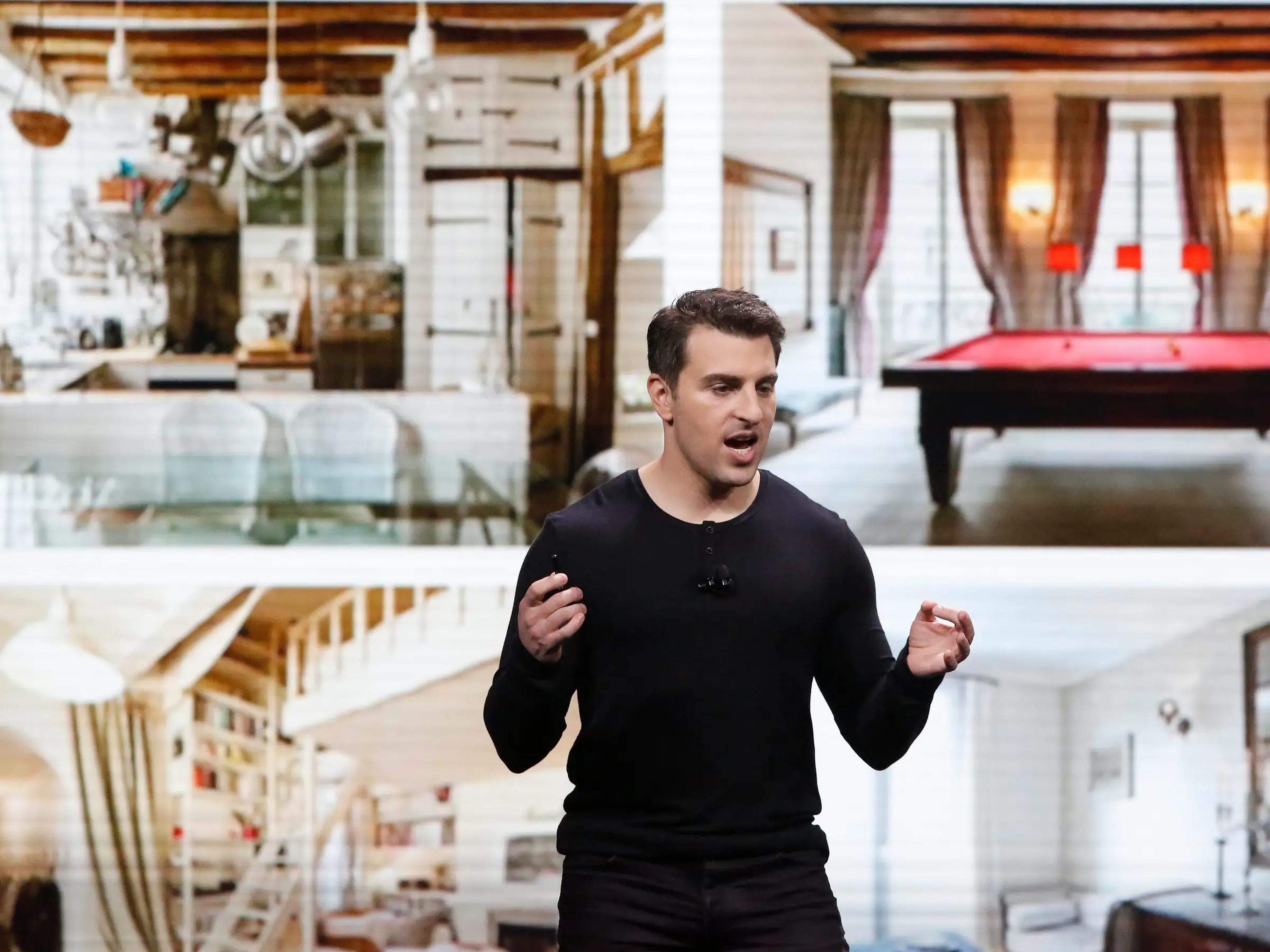 Brian Chesky speaking at a keynote in 2018