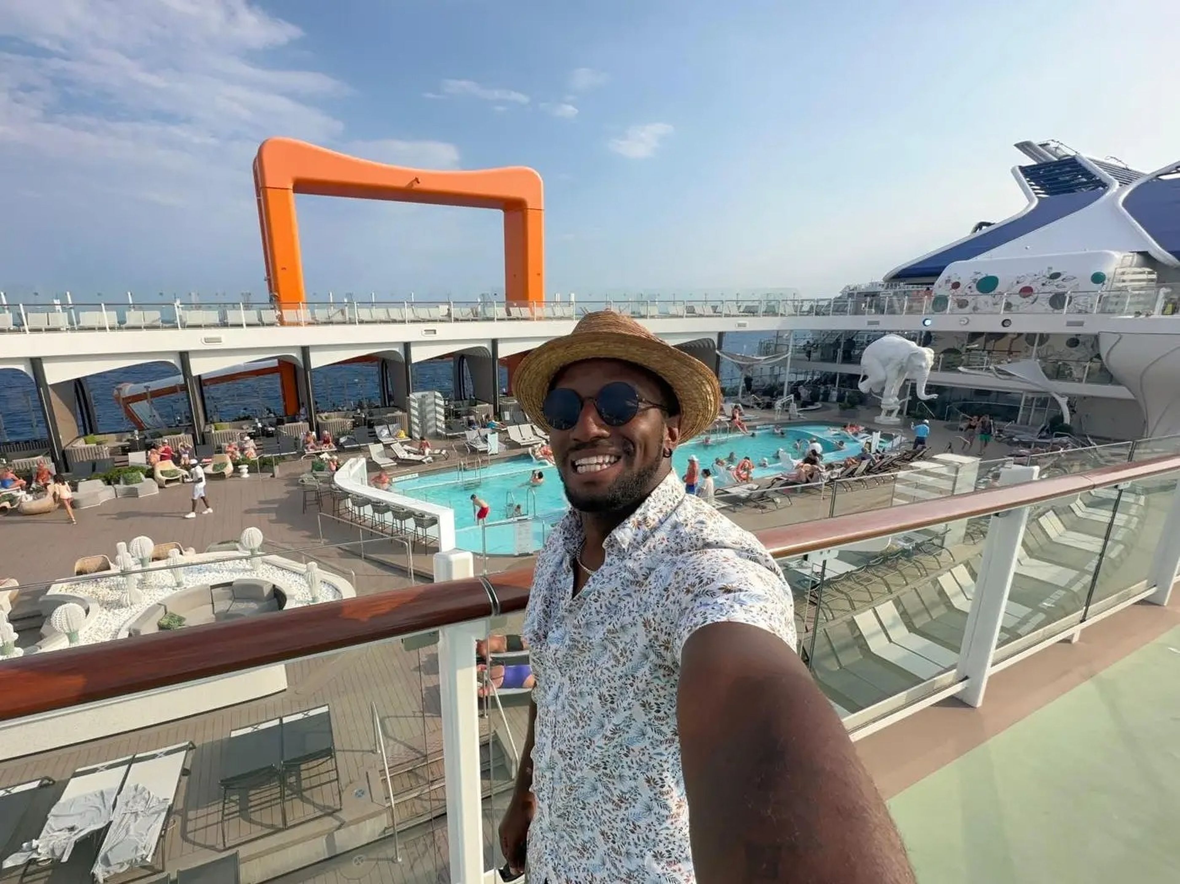 J. Alexander selfie on a cruise ship deck with pool in background