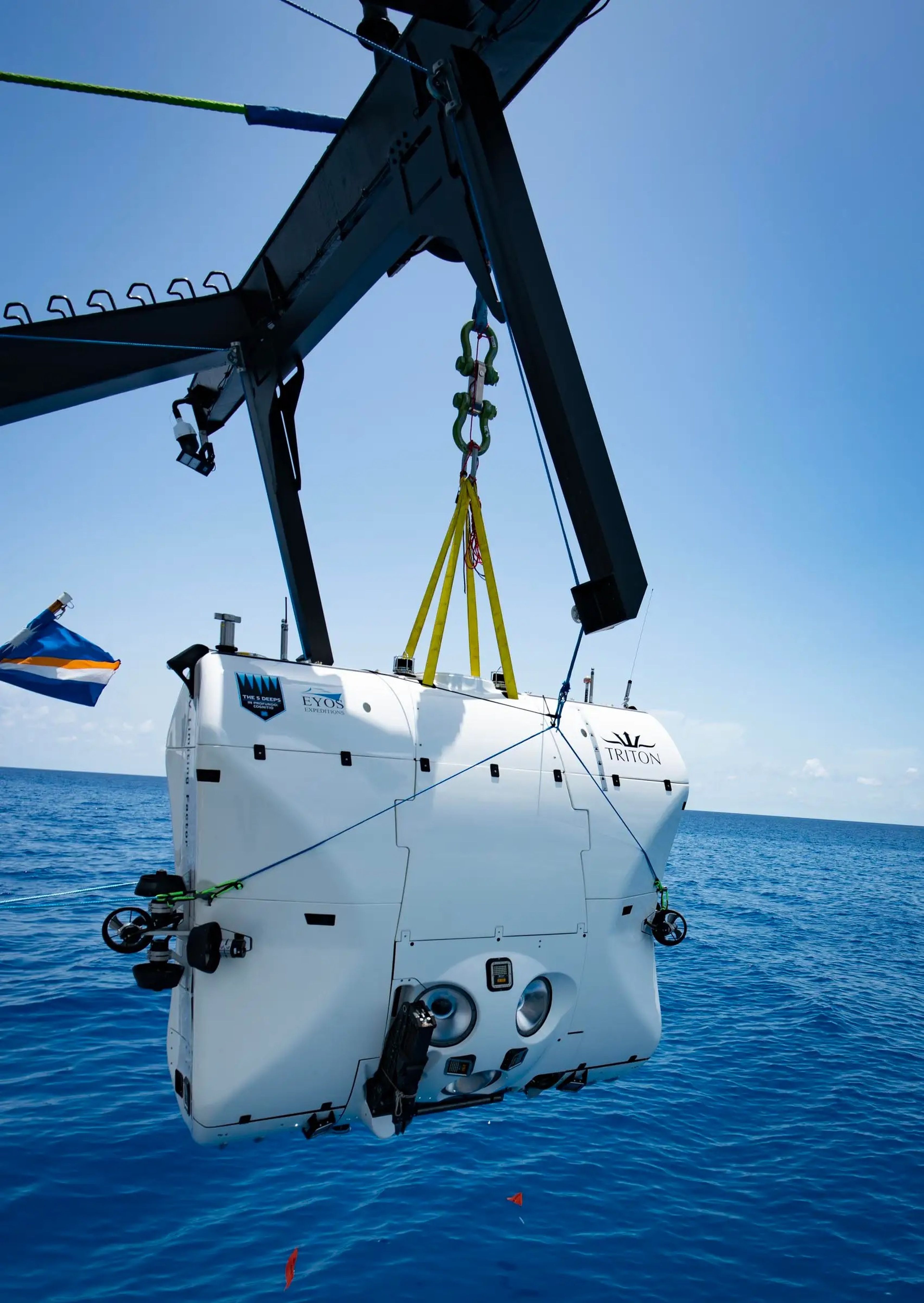 A Triton Submersible getting deposited in the ocean.
