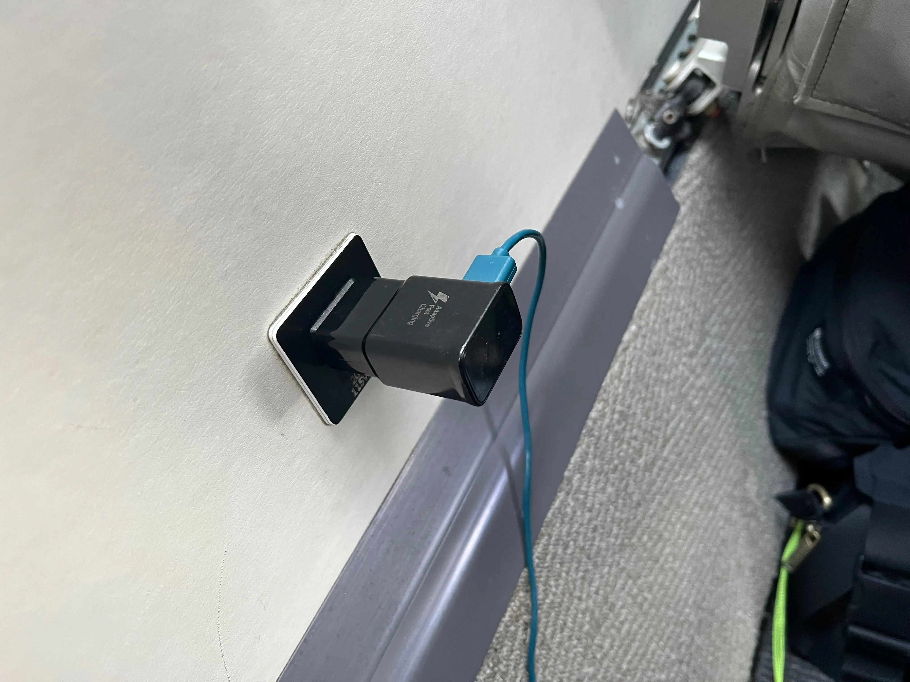 The author's cord plugged into the outlet on the wall of the fuselage.