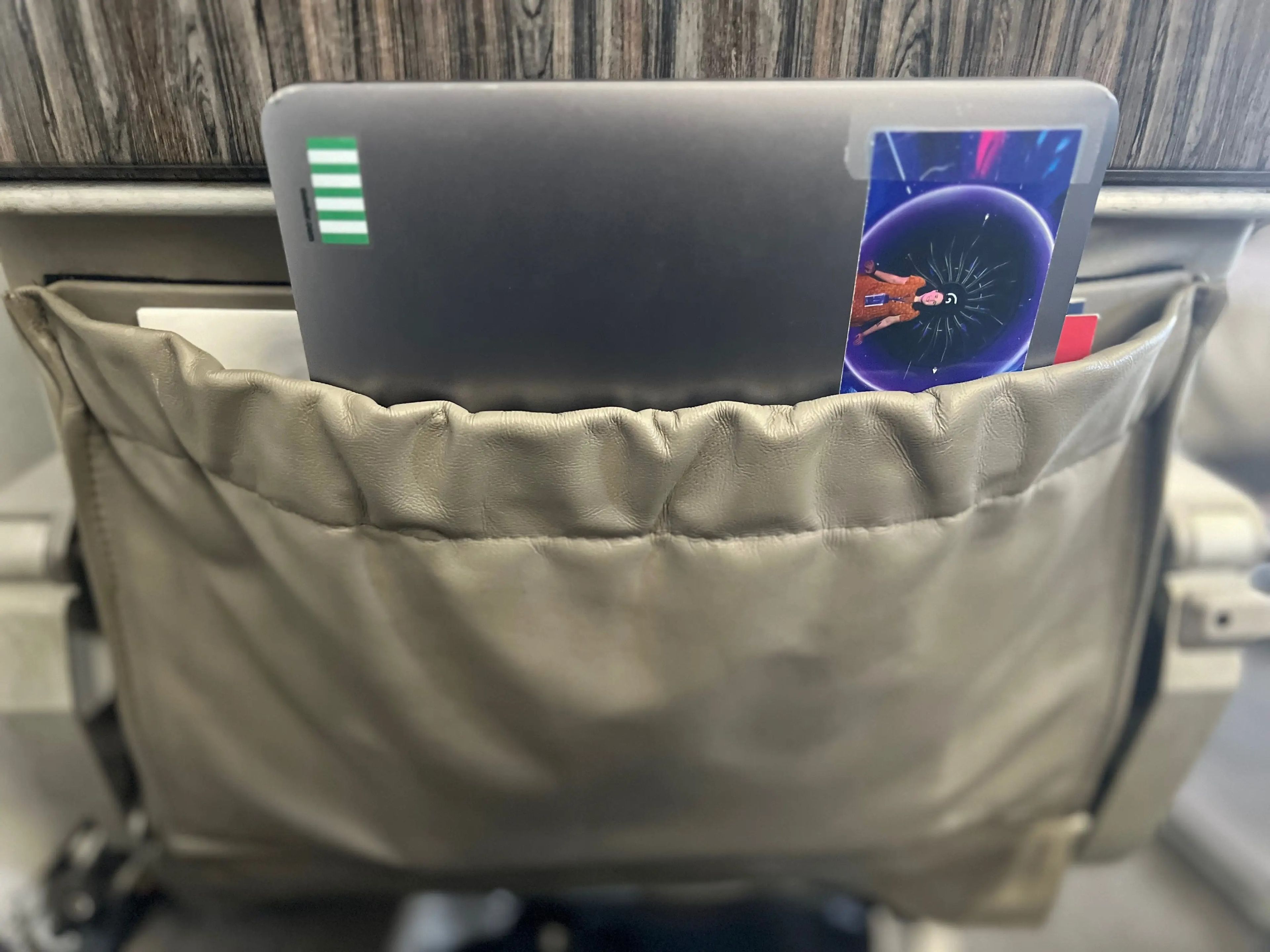 The author's laptop in the seatback pocket.