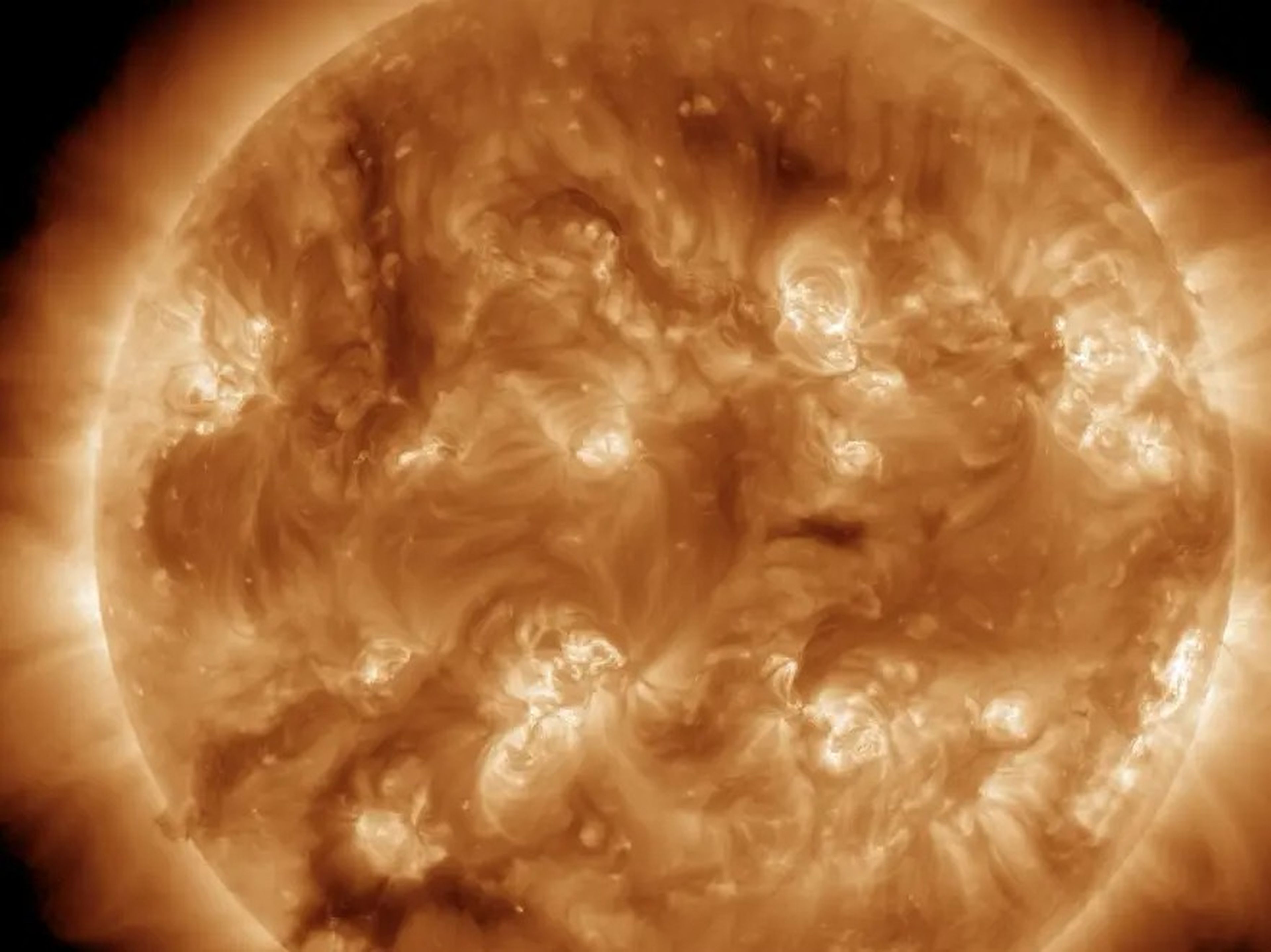 A picture of the sun shows the magnetic turbulence at this surface. Plasma is seen flowing from one sunspot to the next, showing the sun's activity level.