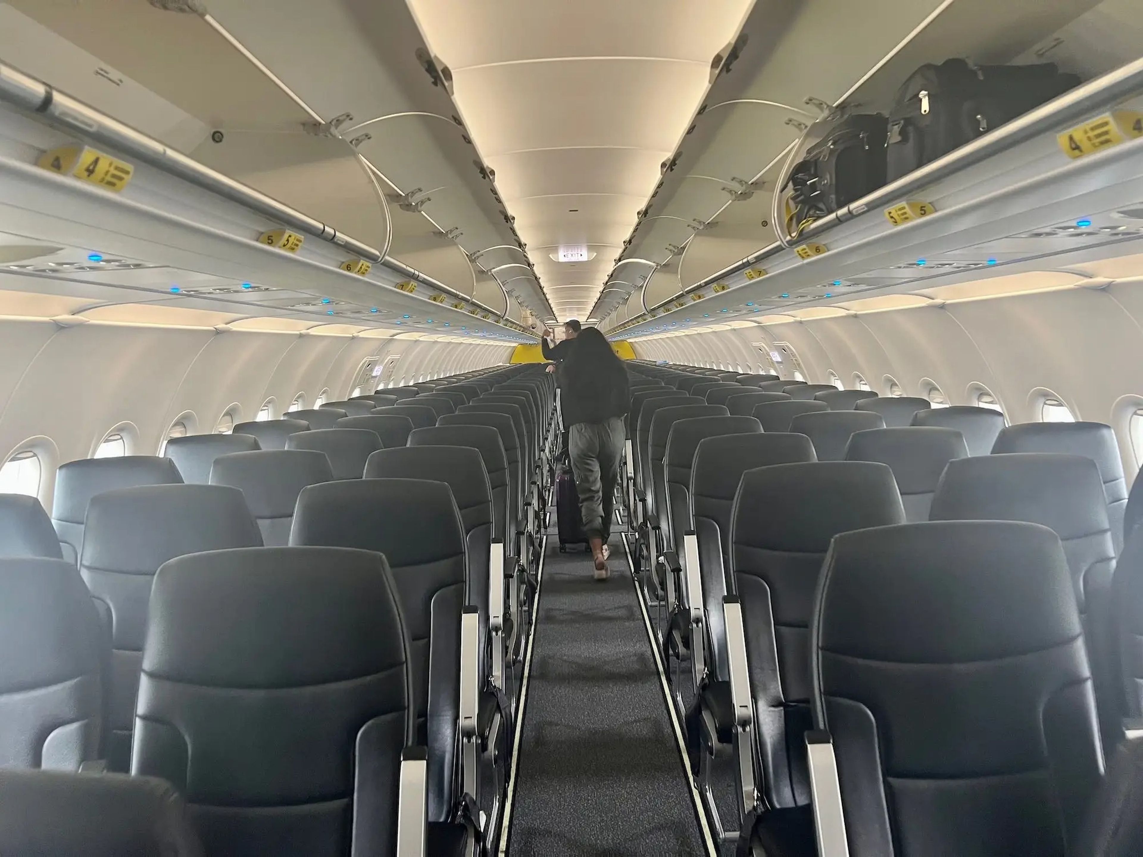 Rows of passenger seats in the interior of Spirit plane.