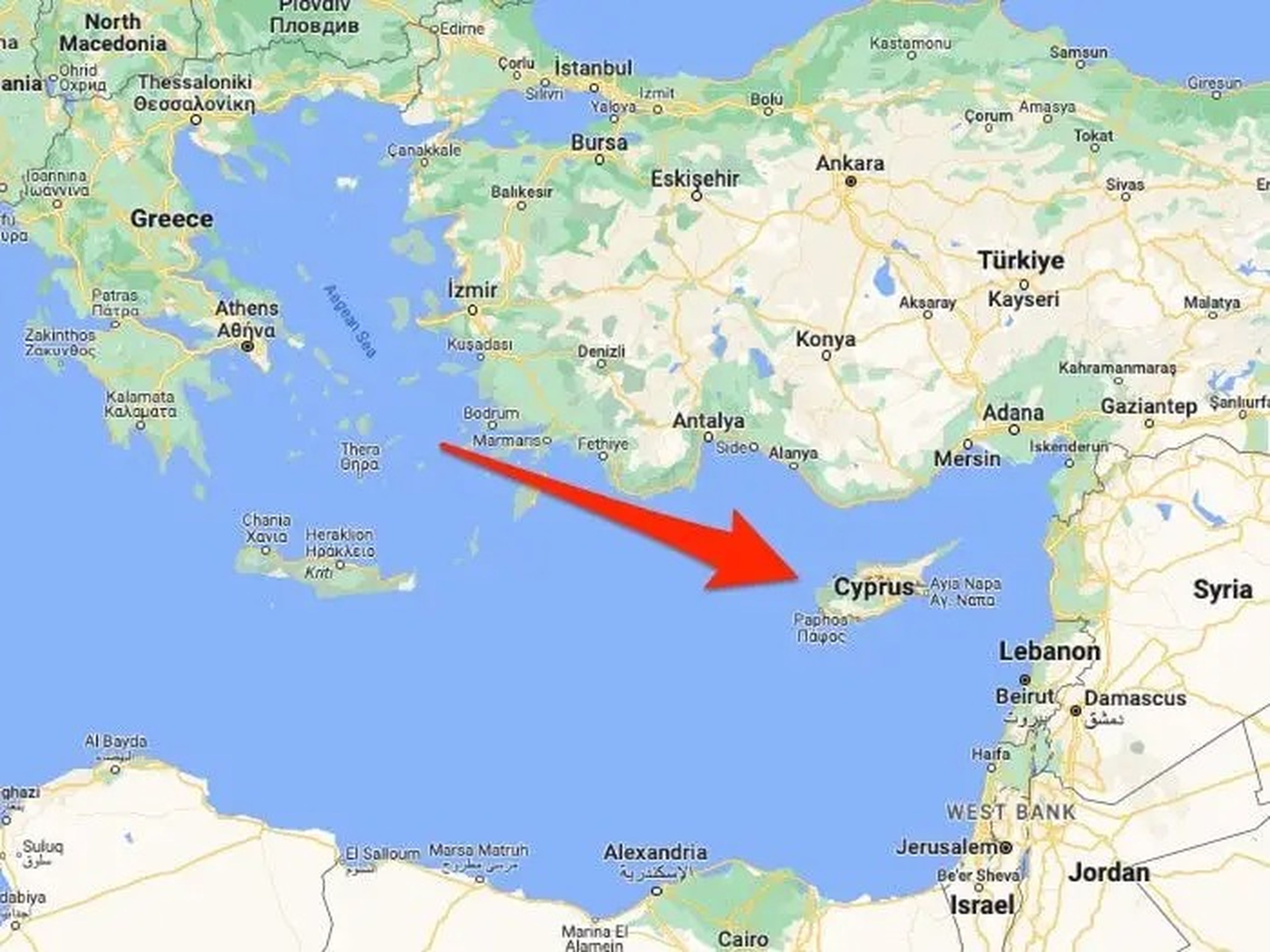 A screengrab of Google Maps shows the area surrounding the island nation of Cyprus in the Mediterranean. A red arrow points to Cyprus on the map.