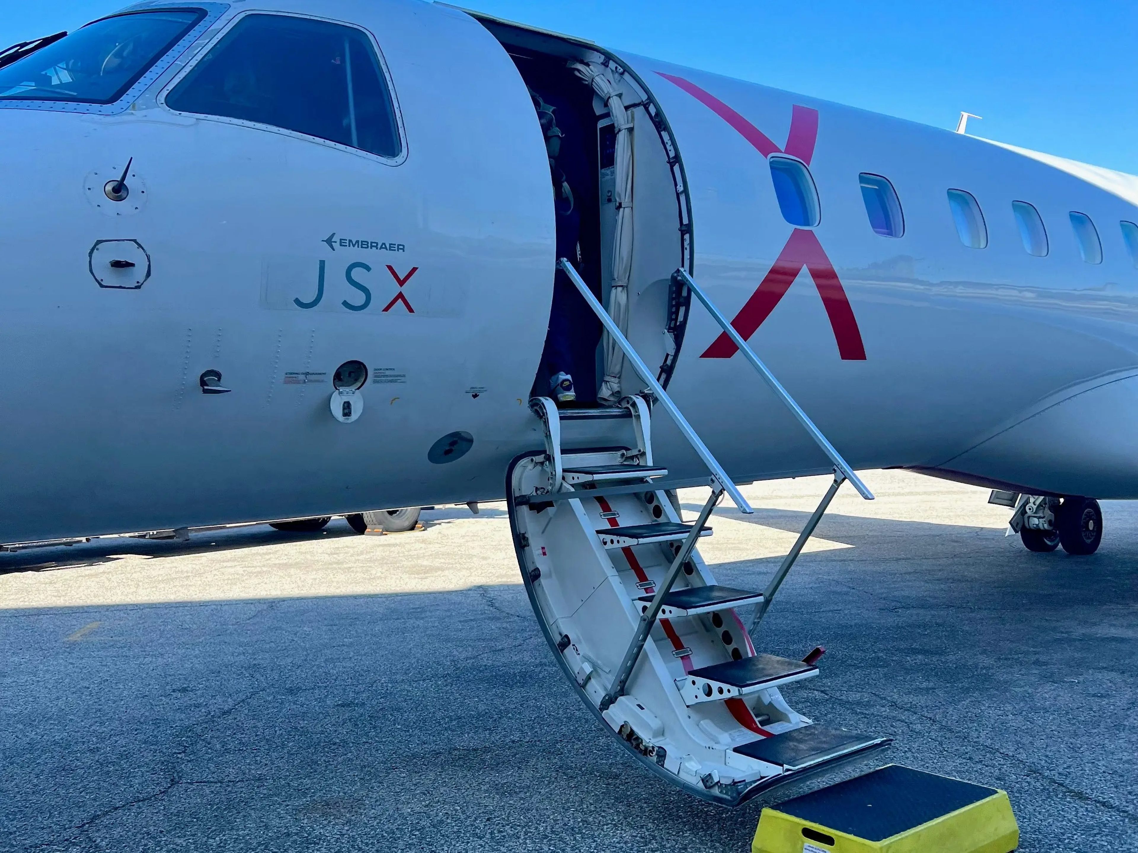 A view of the JSX aircraft with the stairs deployed.