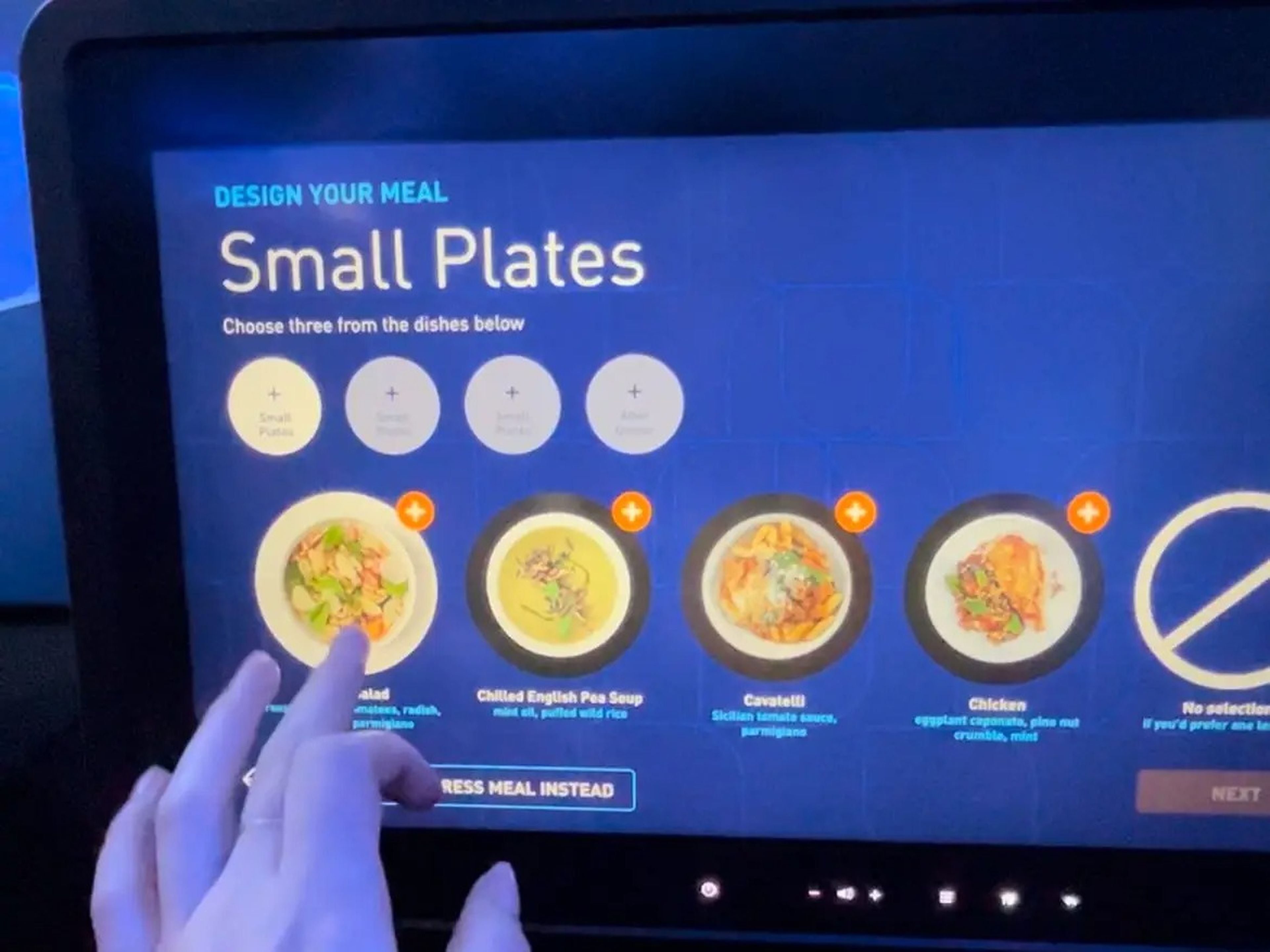The author selecting her meal from the seat-back screen on the JetBlue flight.