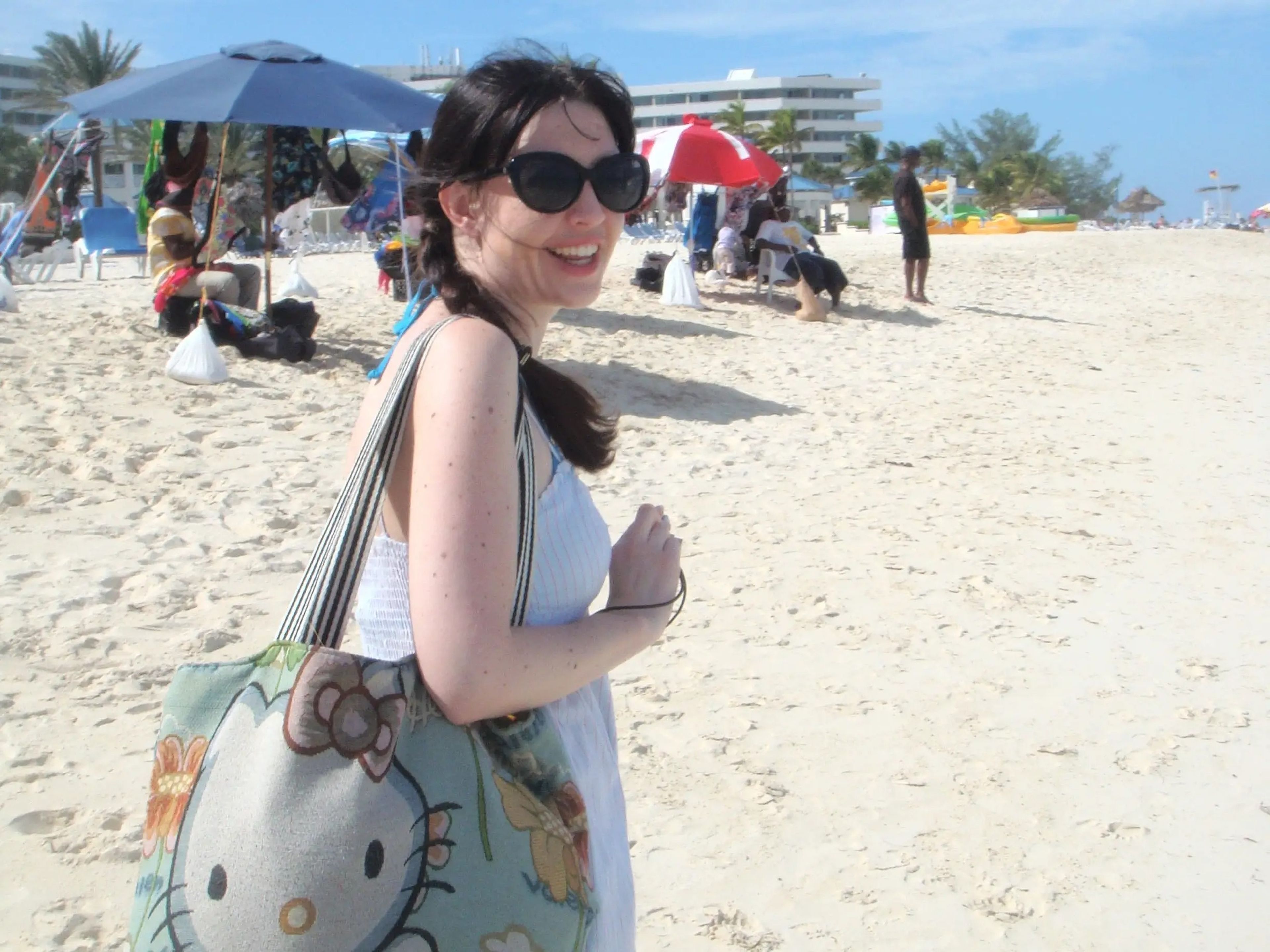 Author Sharon Waugh holding her beach bag