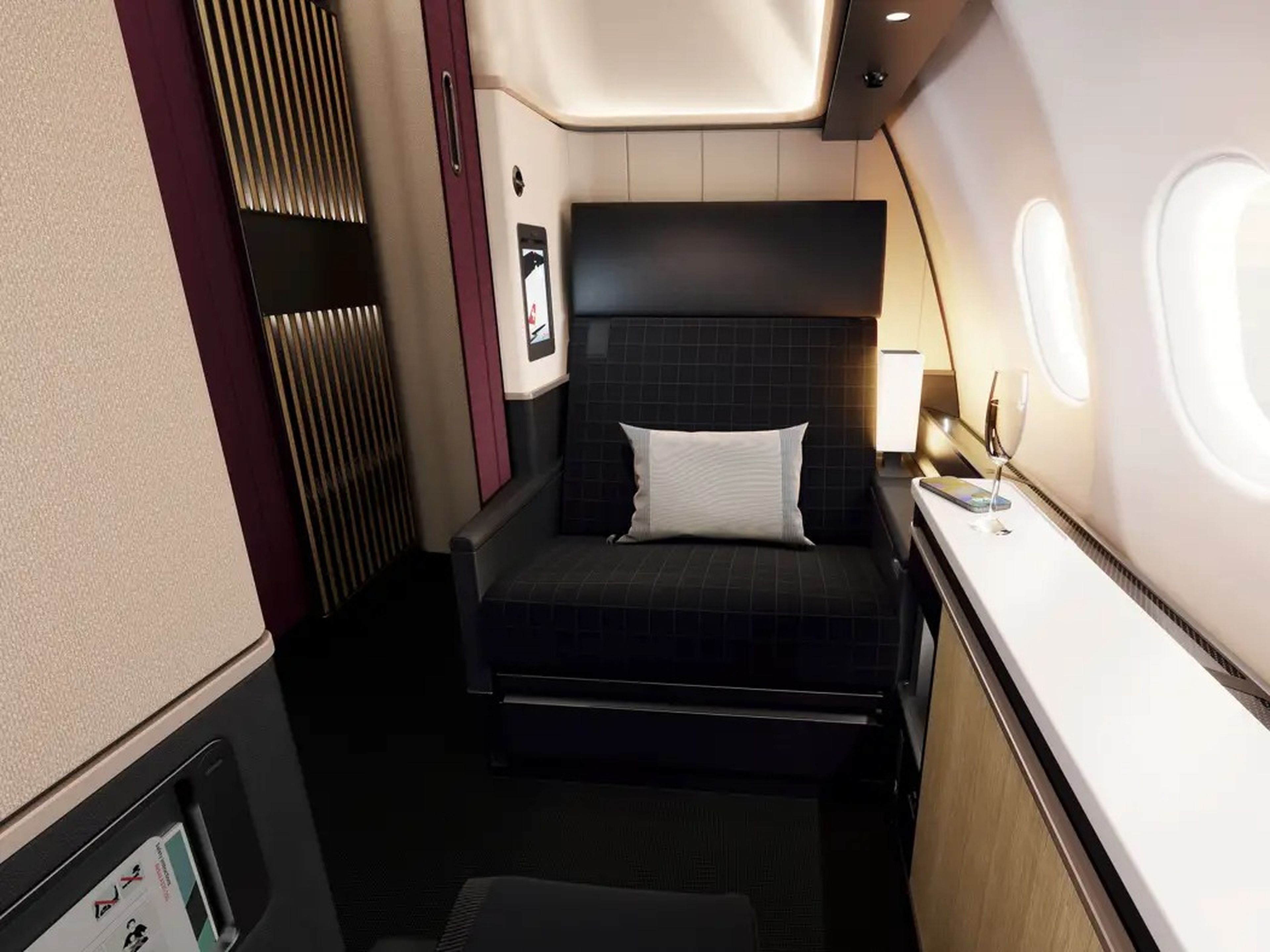 A black lounger inside the SWISS suite with the door closed.