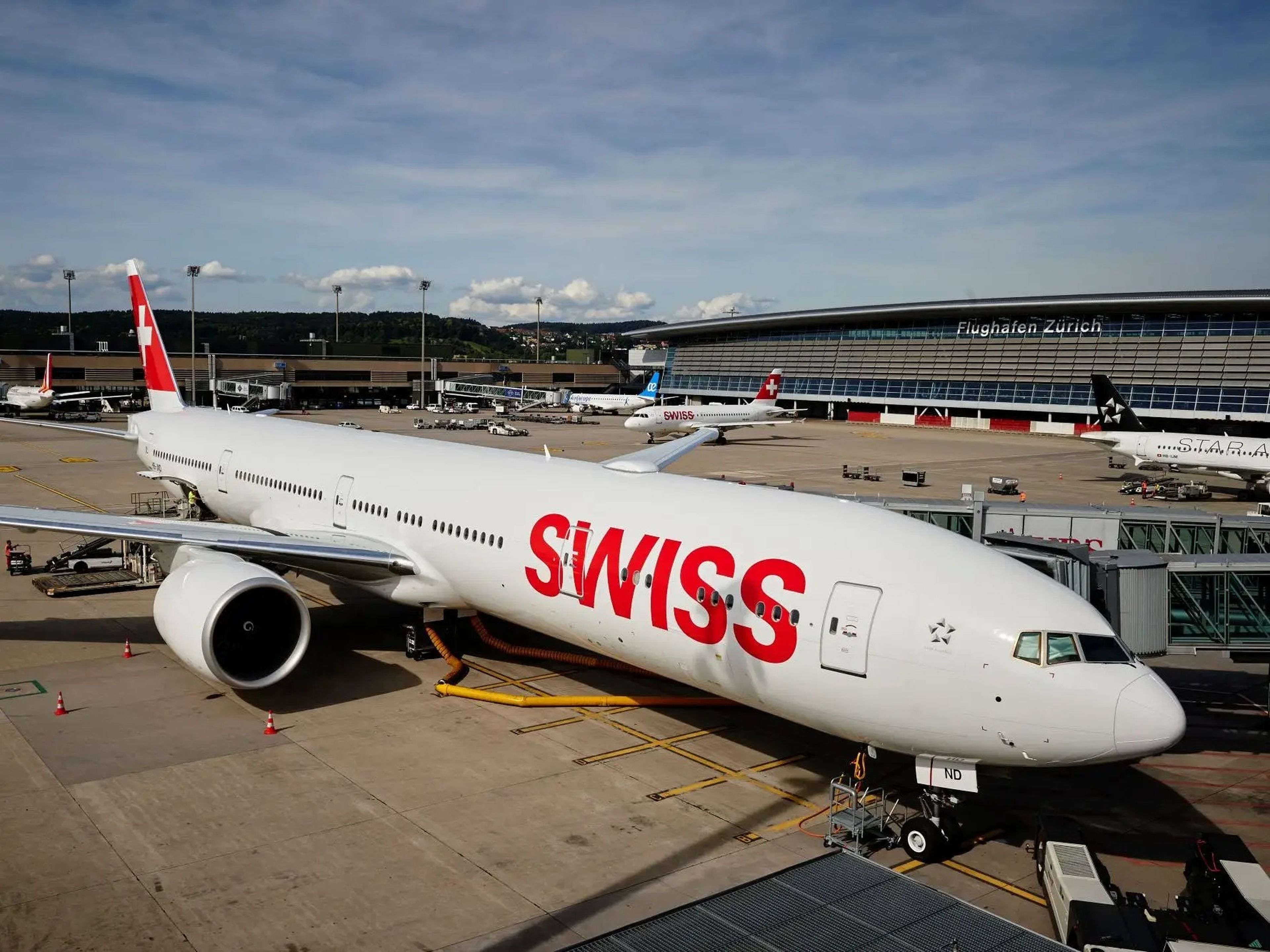 A SWISS 777 parked at the gate.
