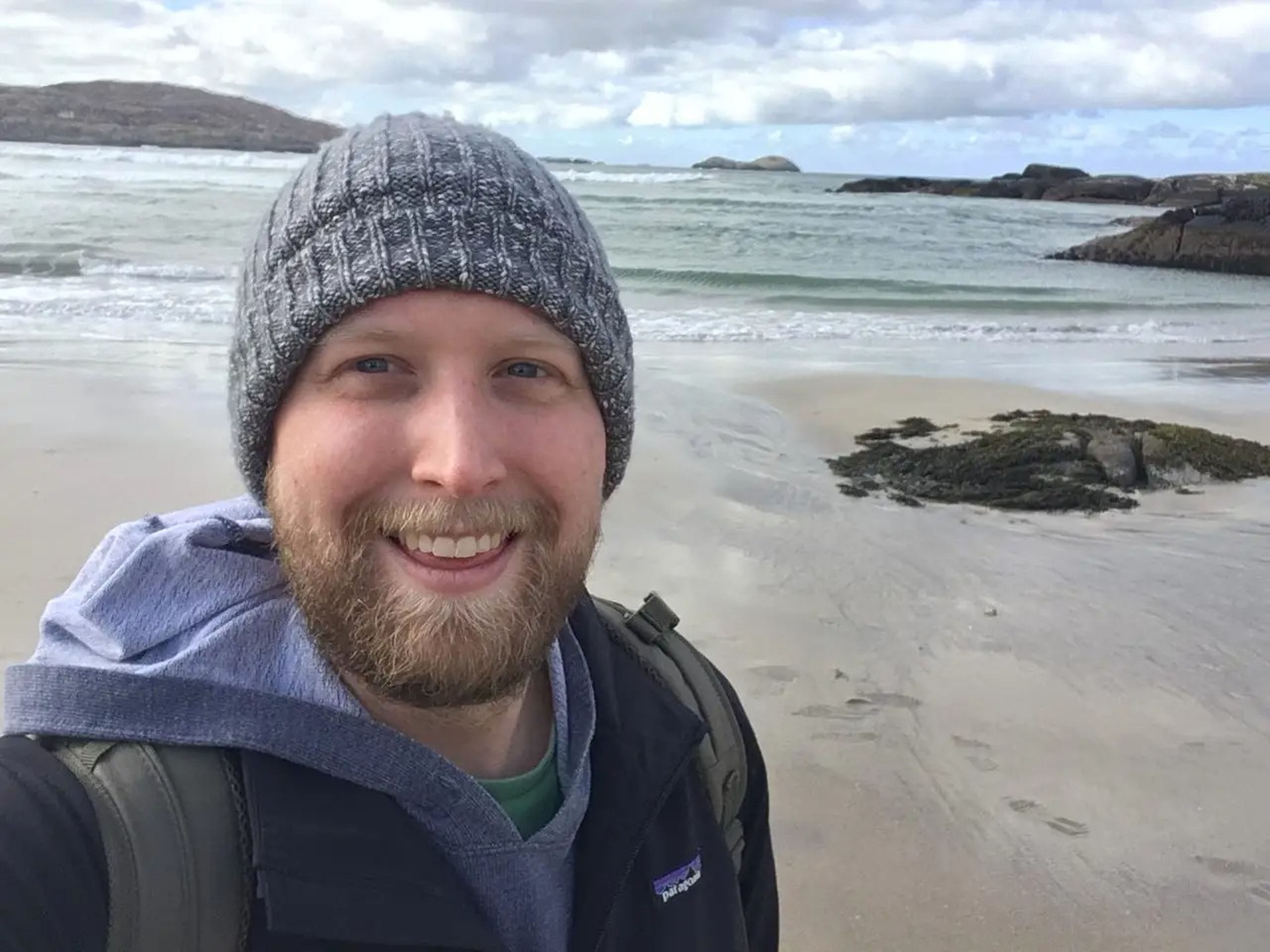tim posing for a selfie on an irish beach