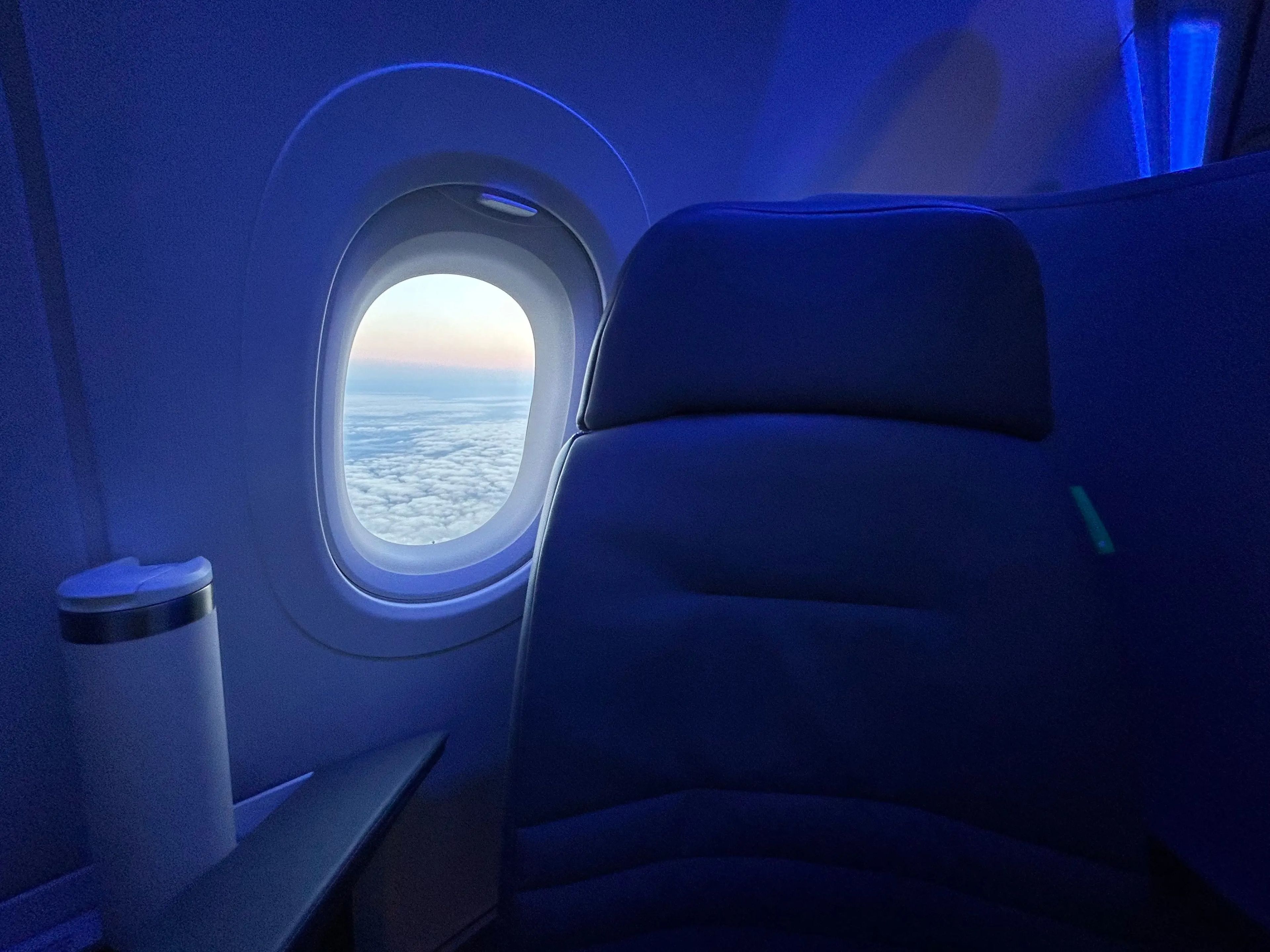A window on JetBlue flight from New York City to Paris.