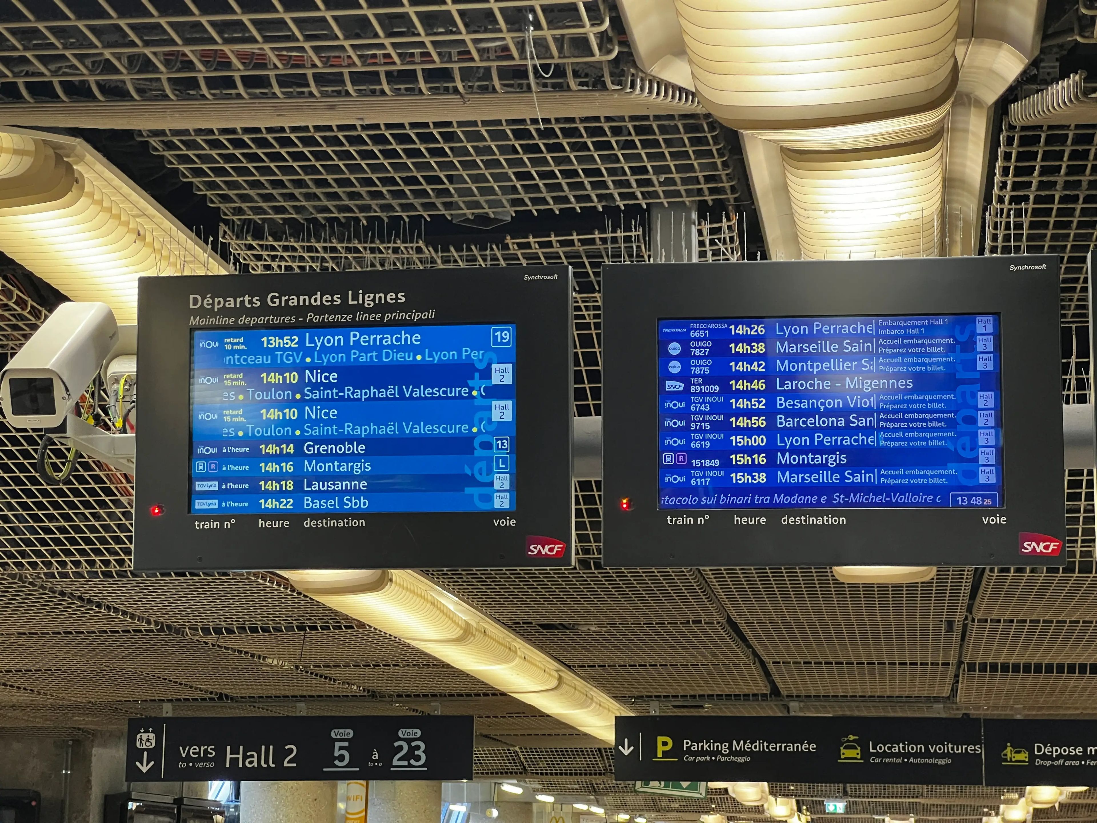 Departure boards in a Paris train station.