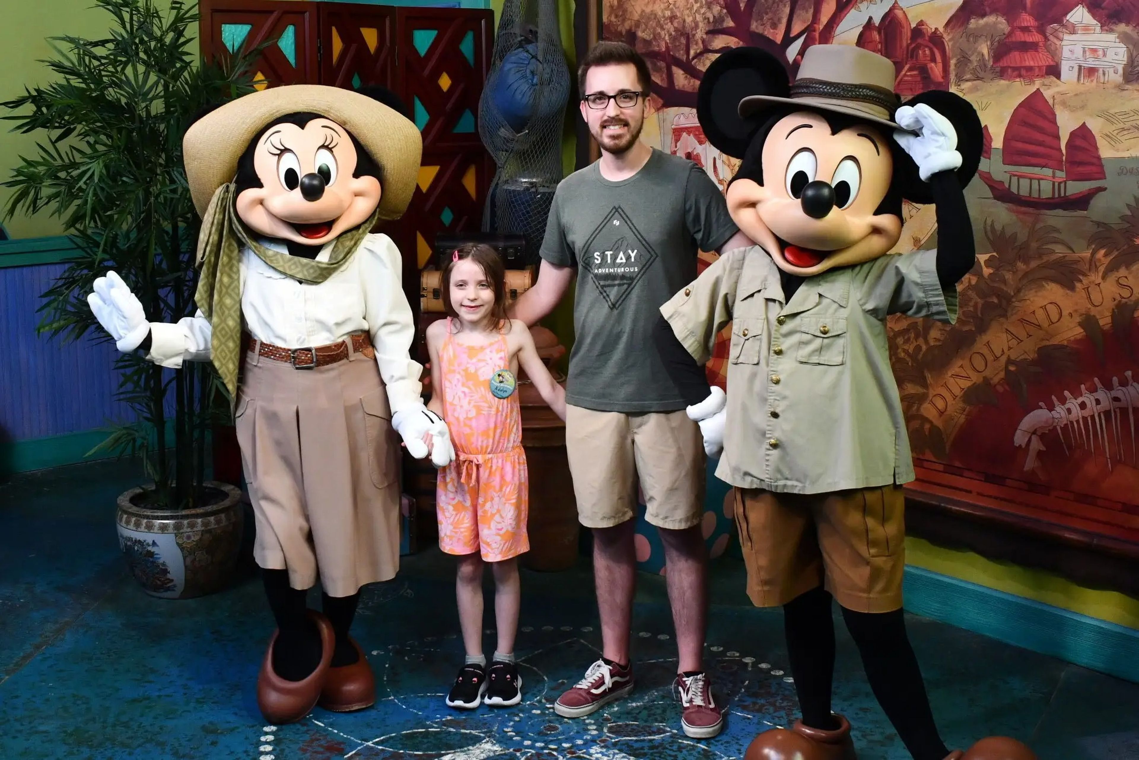 Kyle Werly and his daughter with Mickey and Minnie Mouse.