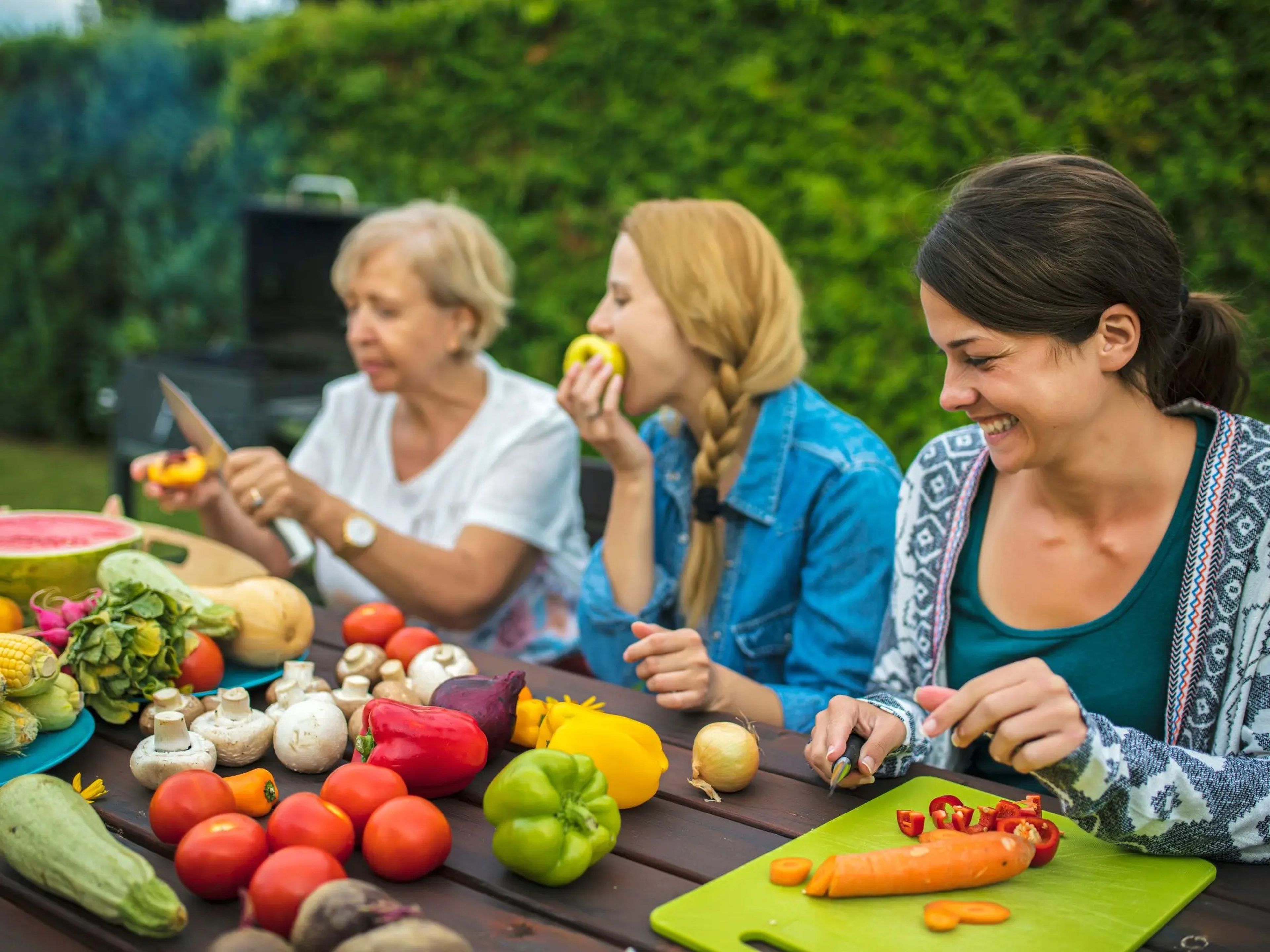 Women eating fruits and vegetables