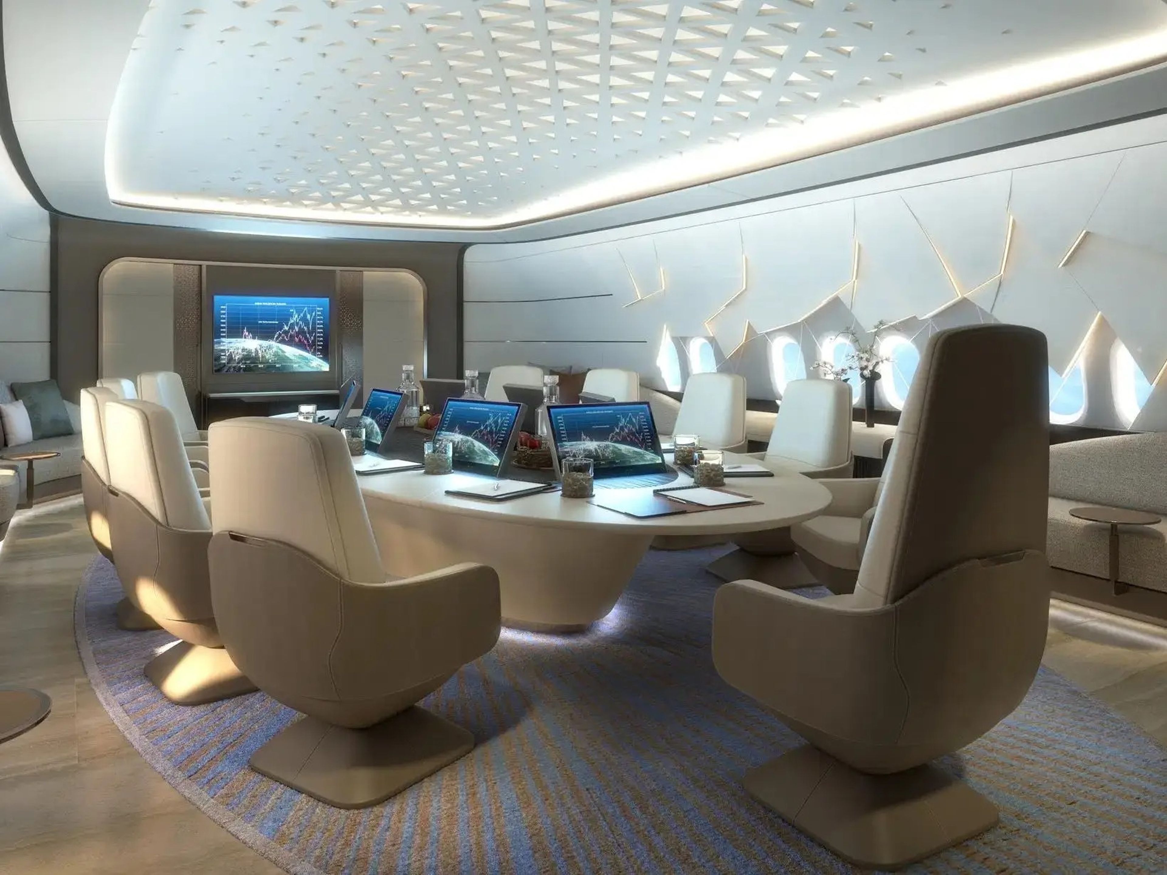 The "Conference&Dining" room onboard the 777X with chairs surrouding the circle table.