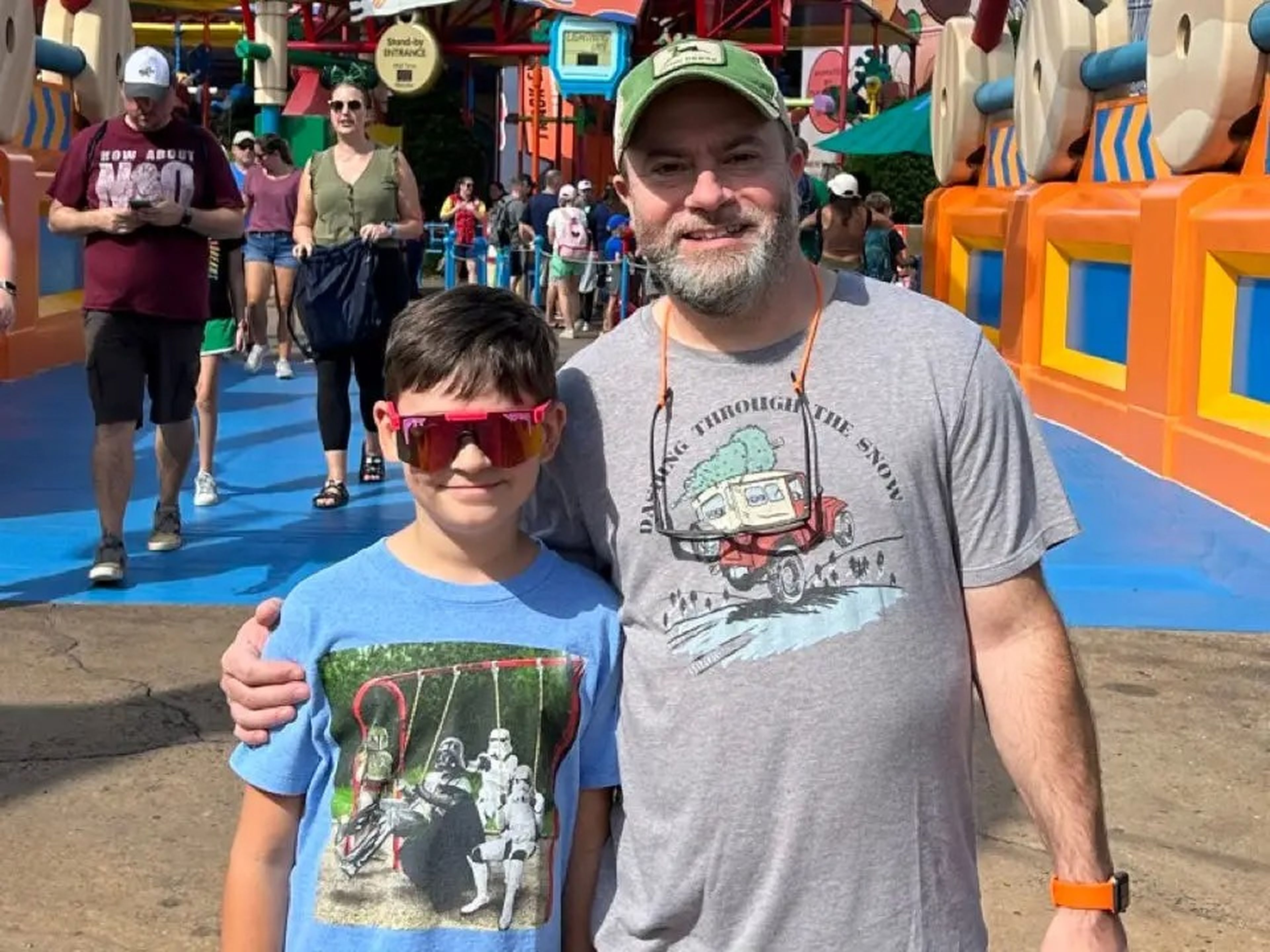 Author Matt Cabral and his son at Disney World in front of Slinky Dog Dash