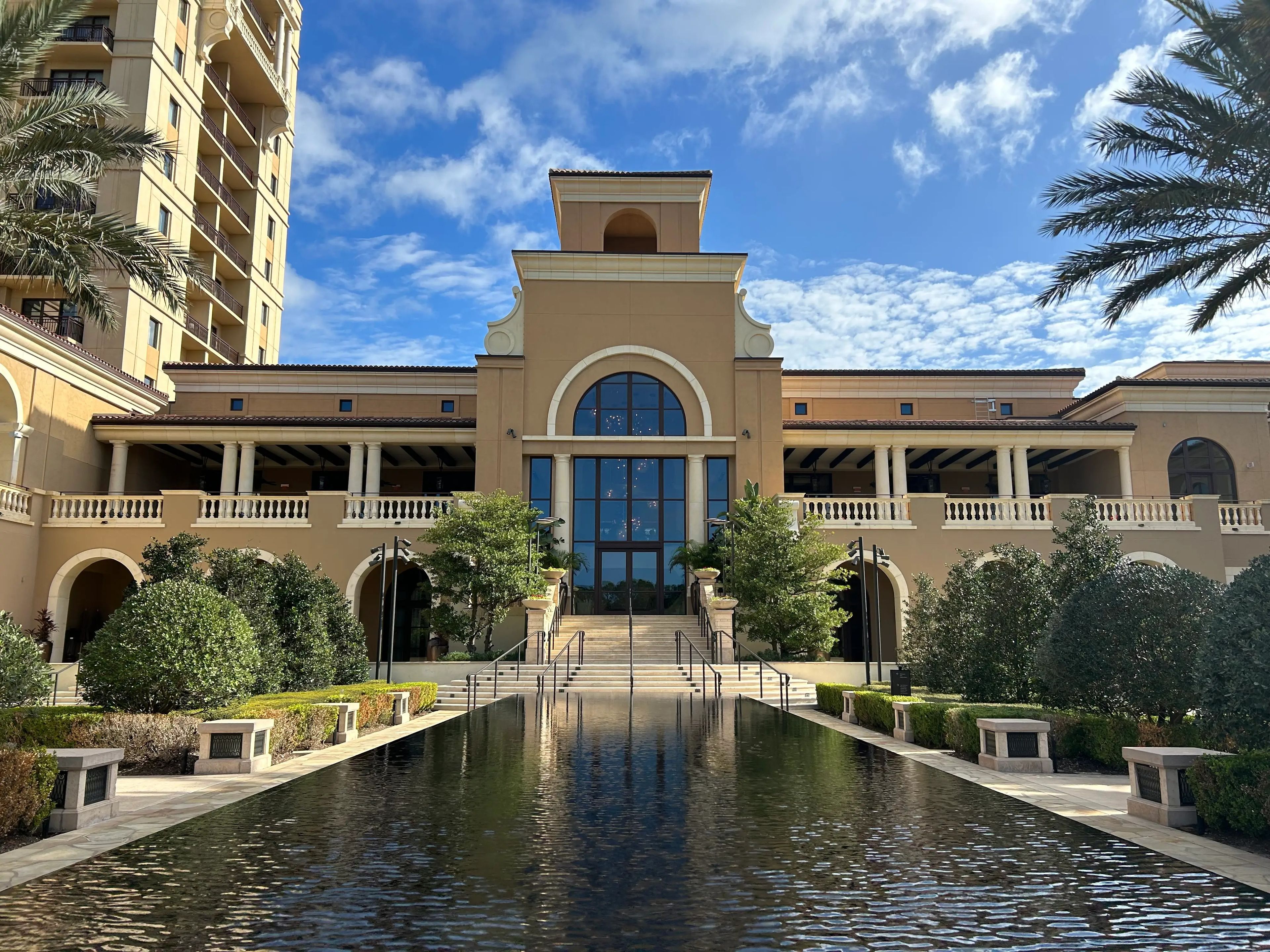Disney World Four Seasons exterior with view of waterway leading to building entrance 