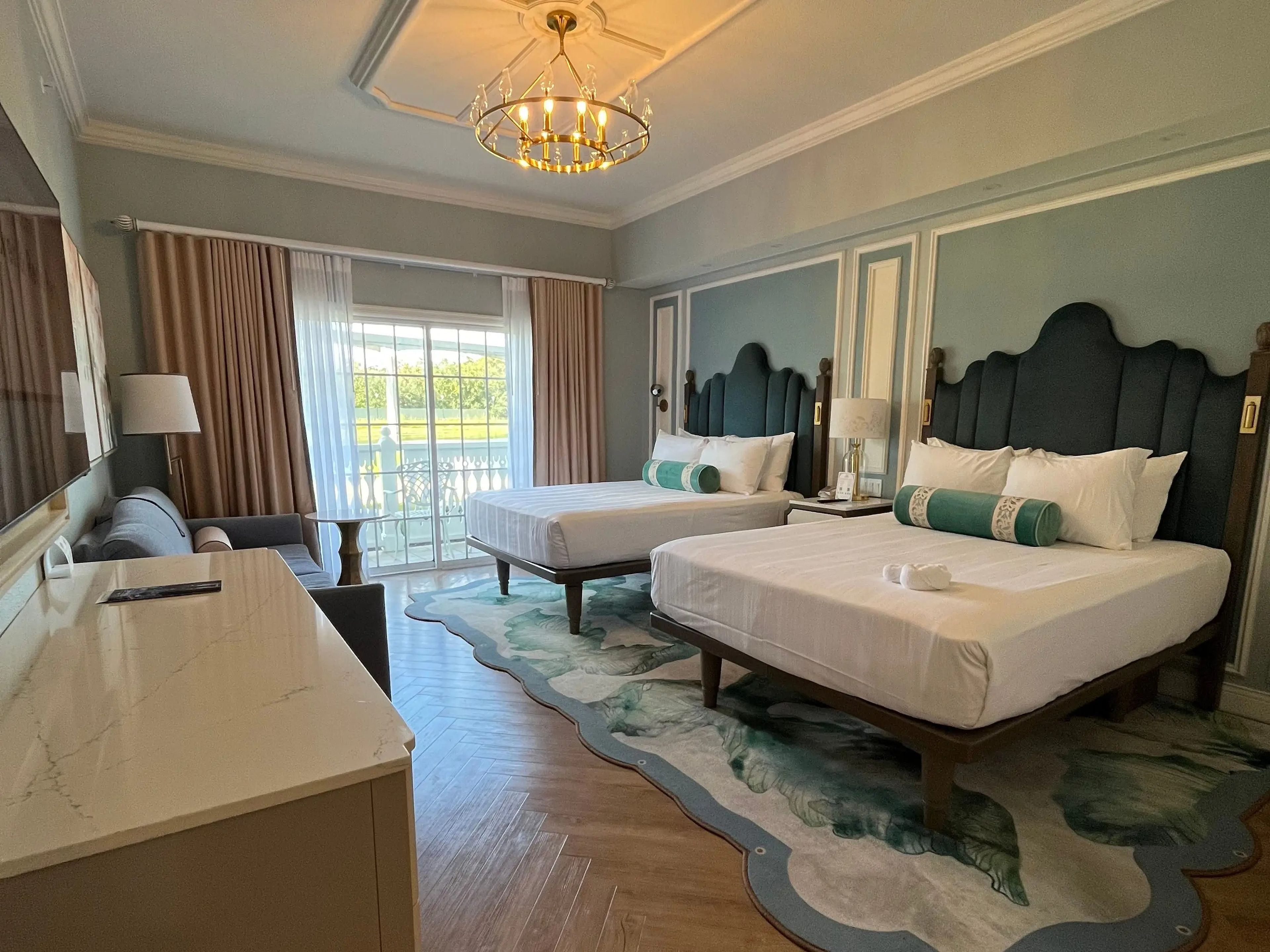 interior shot of a suite with two queen beds at the grand floridian in disney world