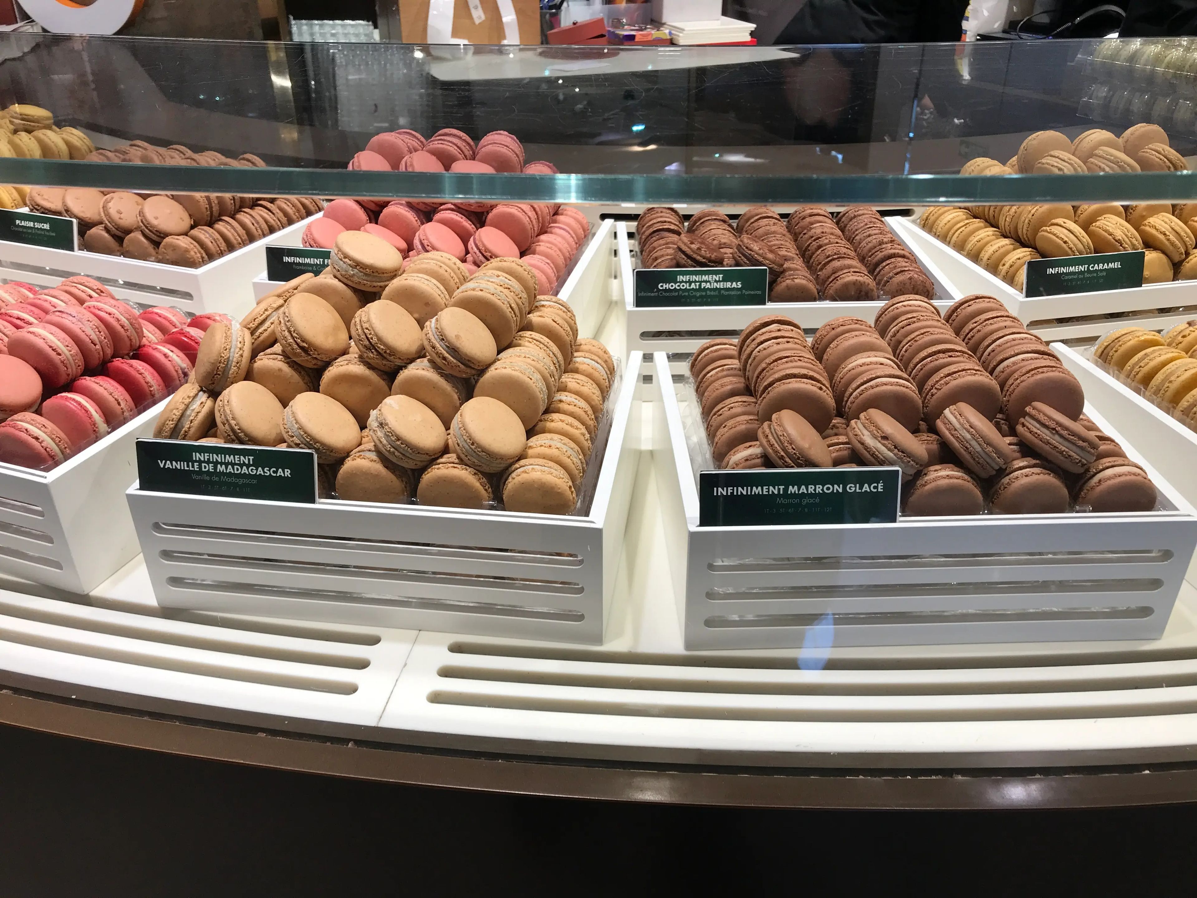macarons inside a pastry case in paris