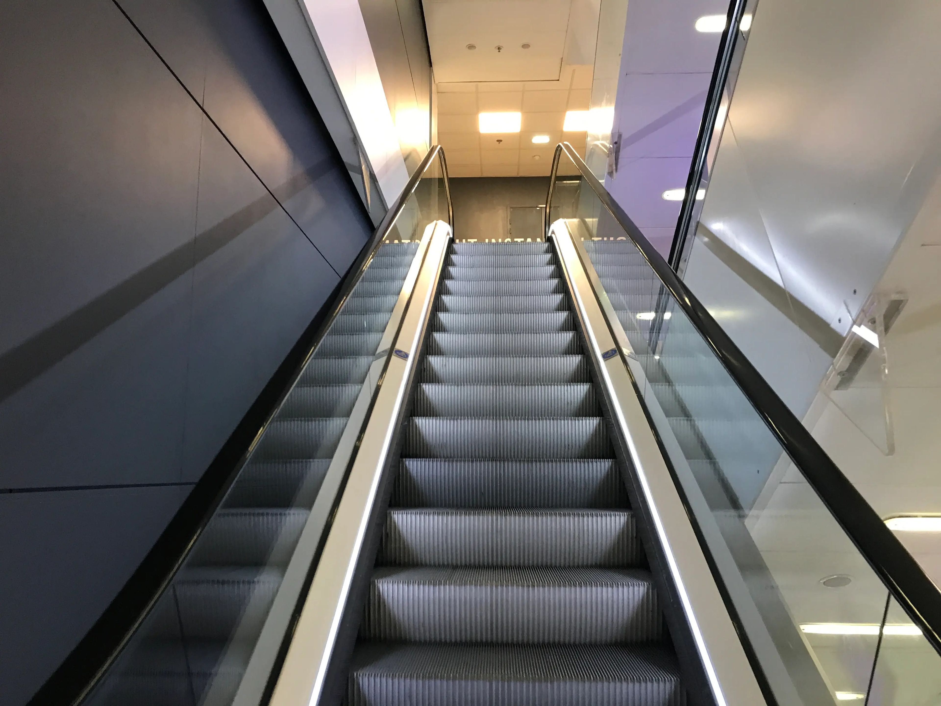 shot of escalators inside a building in paris