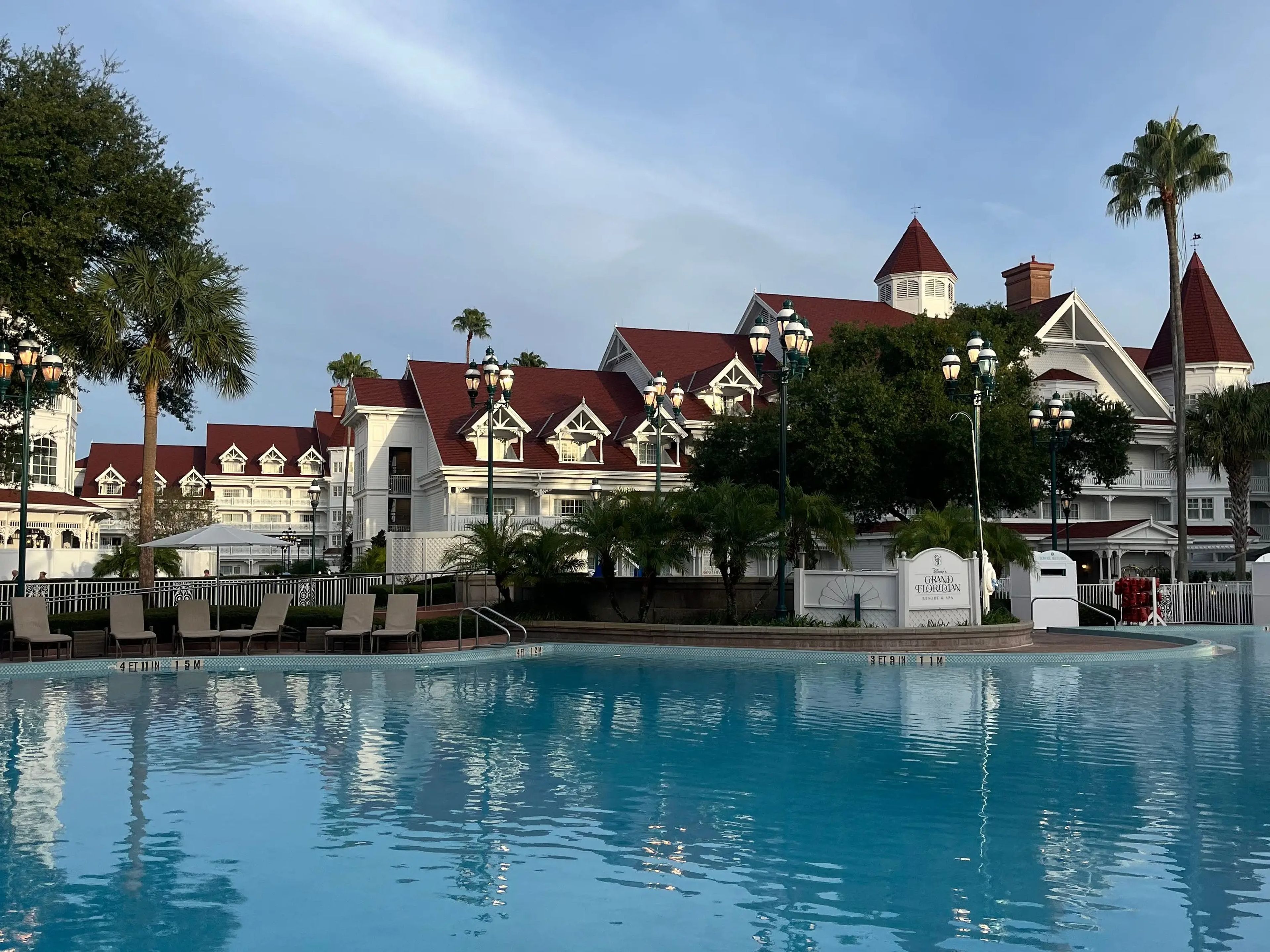shot of the grand floridian resort from behind the resort's pool