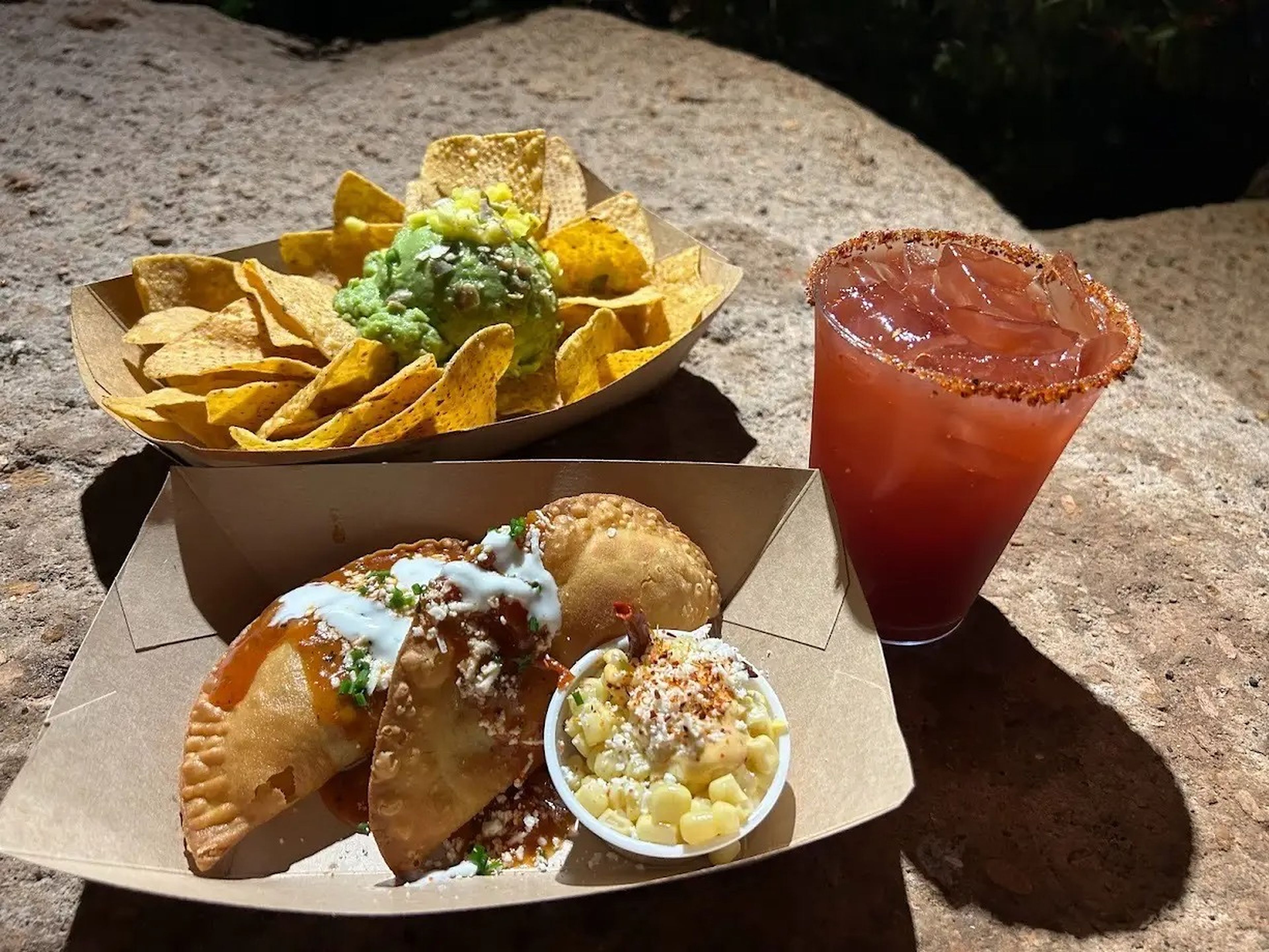 Tortilla chips, cocktail, and empanadas at Disney World 