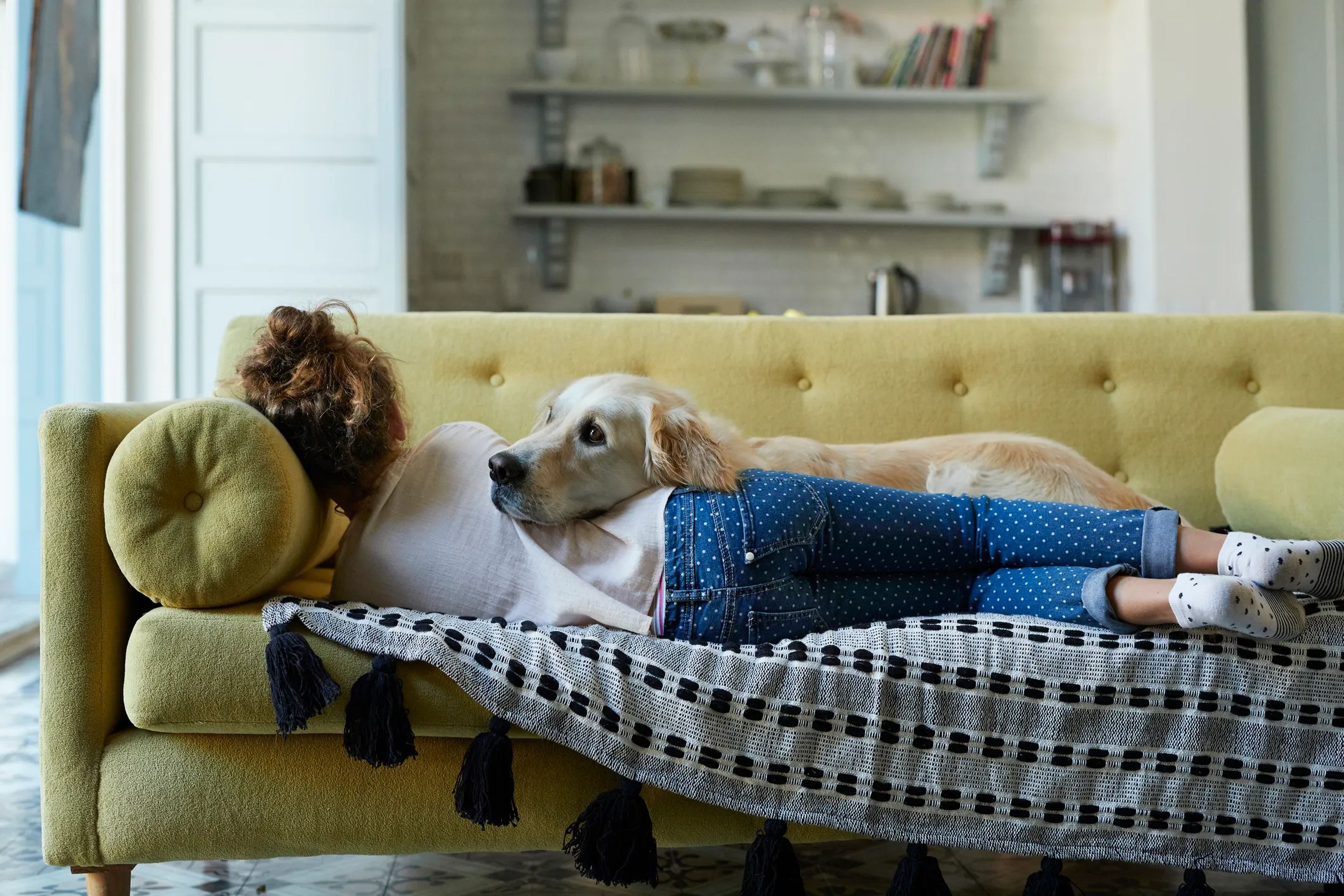 Woman on a couch with dog