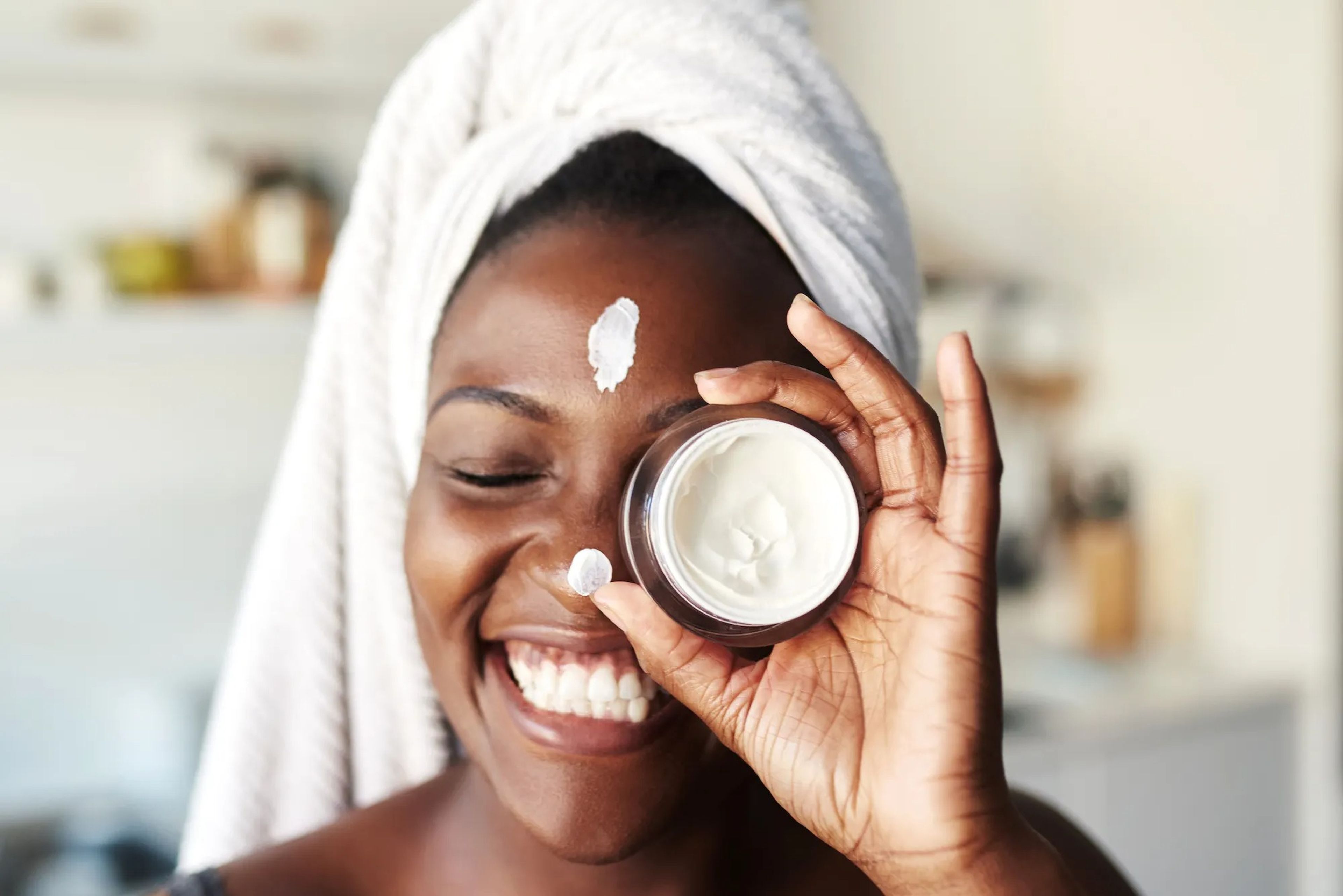 Woman using skincare product
