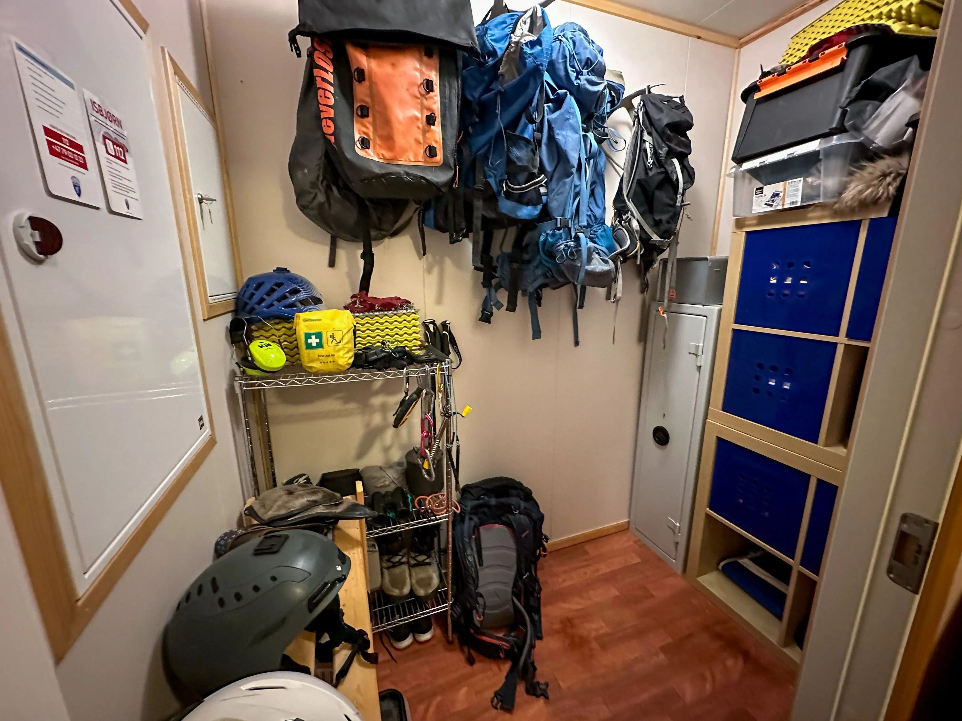 The writer's gear room, which contains backpacks, helmets, rope, and a first-aid kit