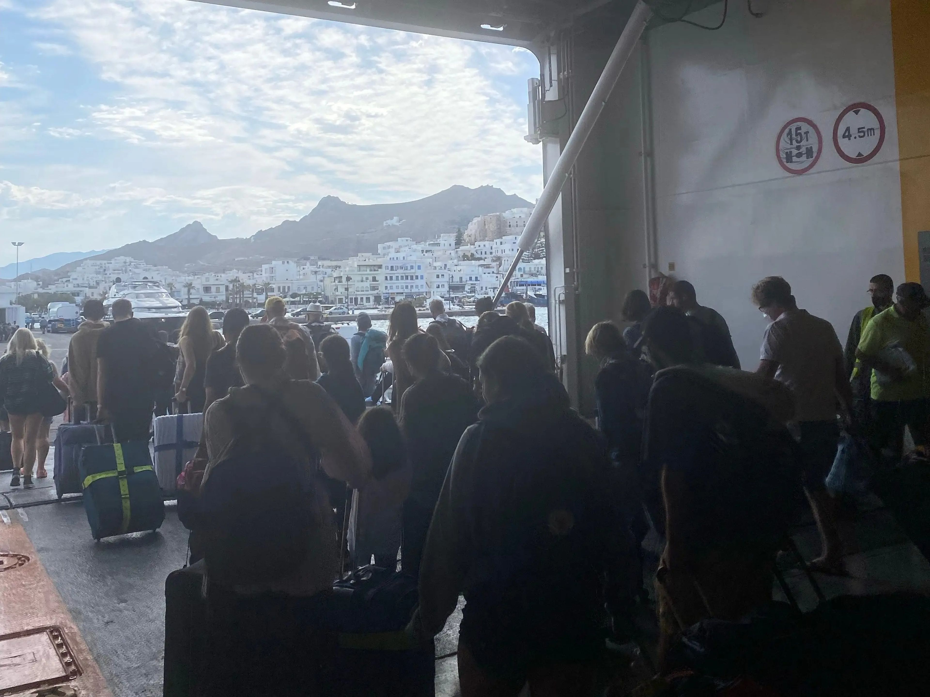 crowds exiting a ferry in greece