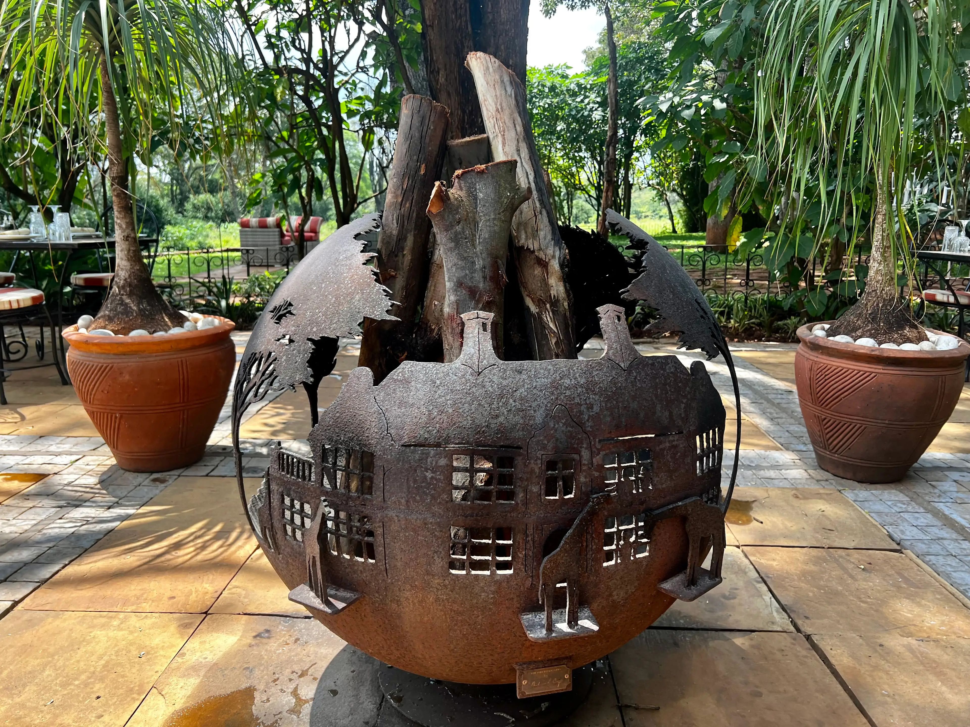 Fire pit with giraffe carvings 