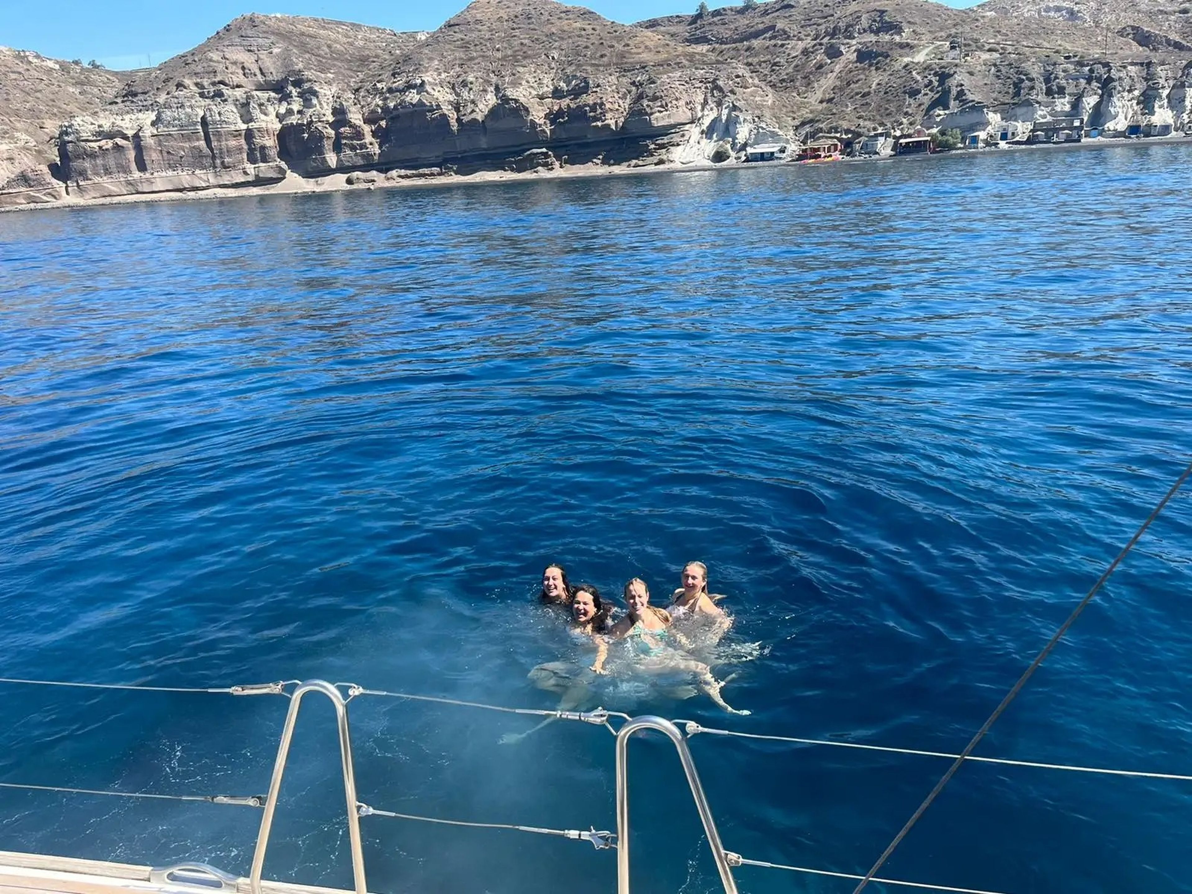 jordana and her friends swimming in the ocean in greece