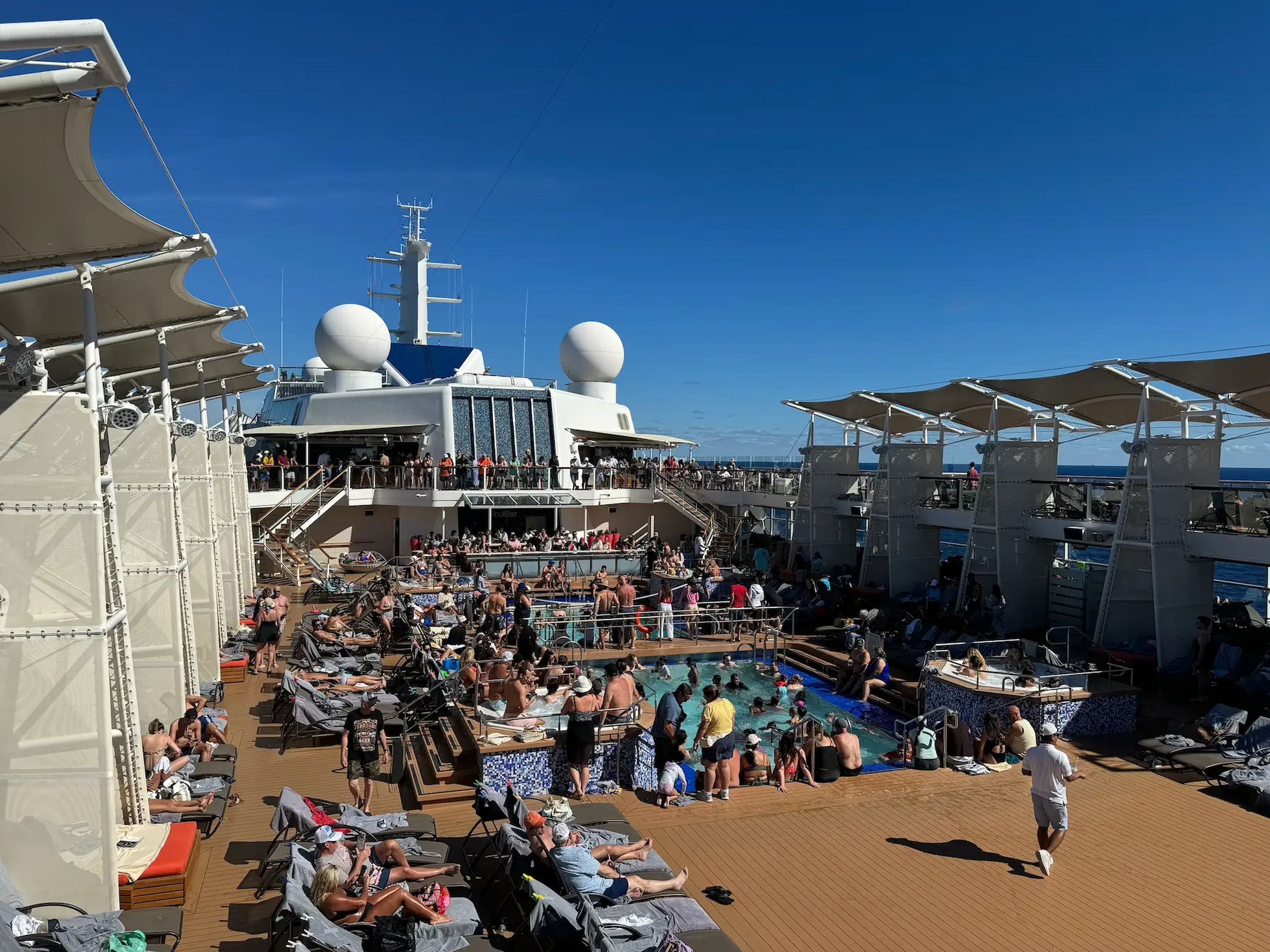 photo of a crowded pool deck on a cruise ship