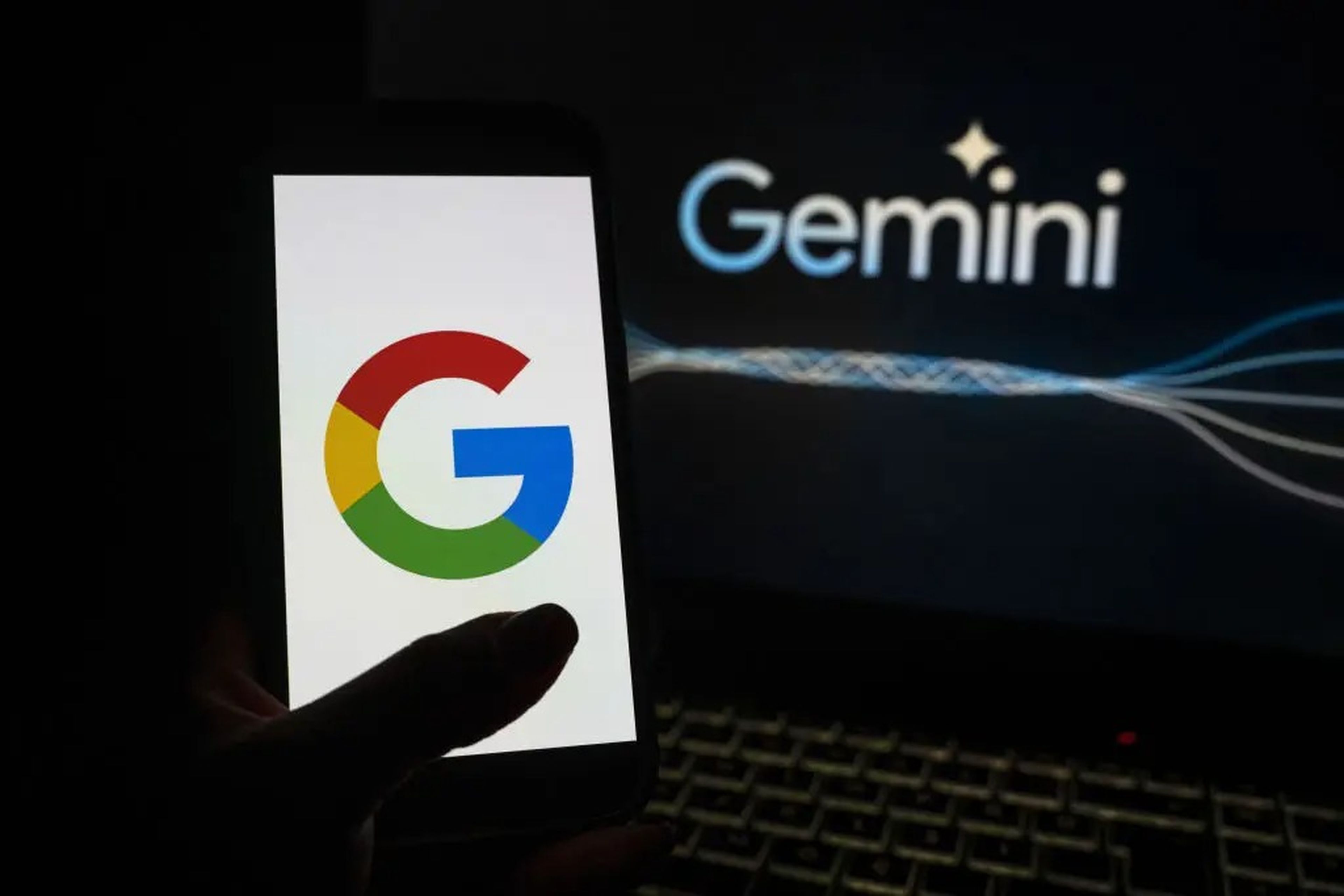 In this photo illustration the logo of 'Google' is displayed on a phone screen in front of a 'Google Gemini' logo.