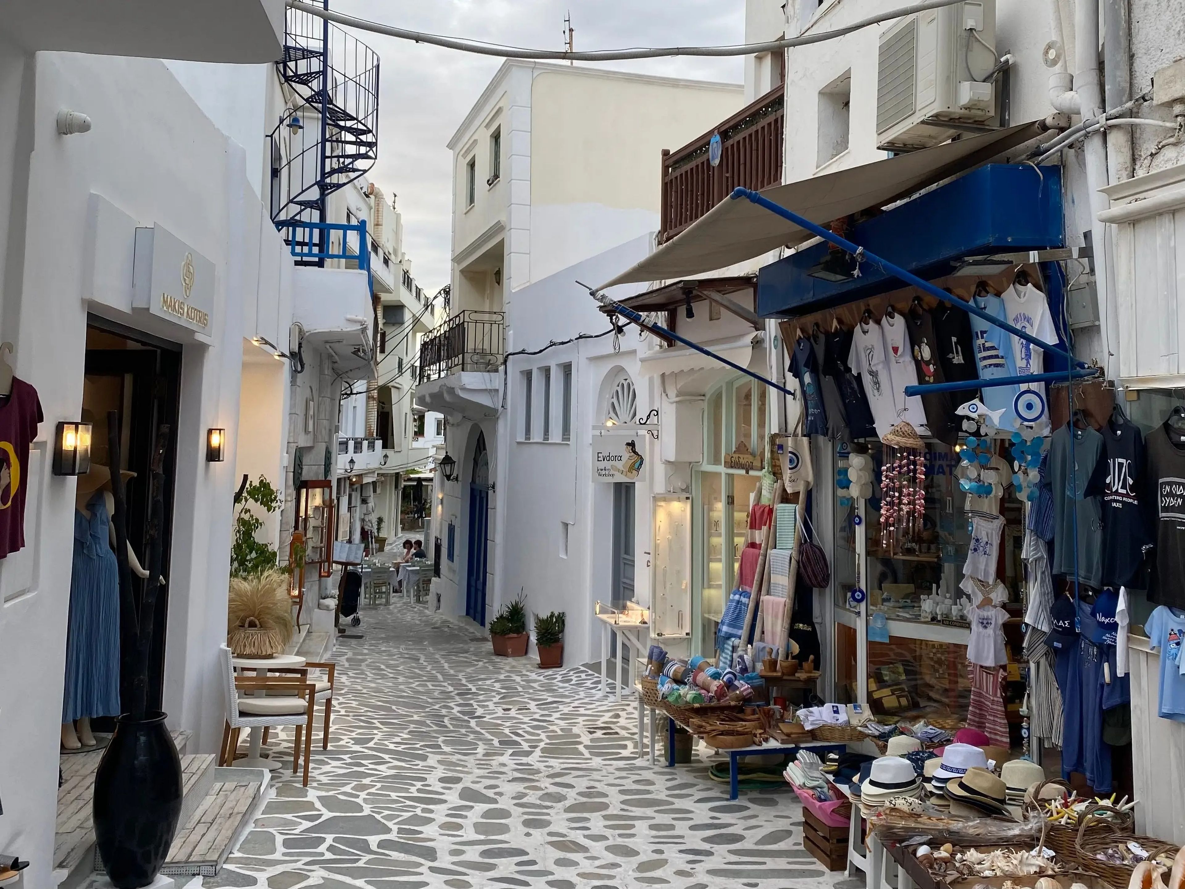 photo of a street in naxos greece with shops and apartments