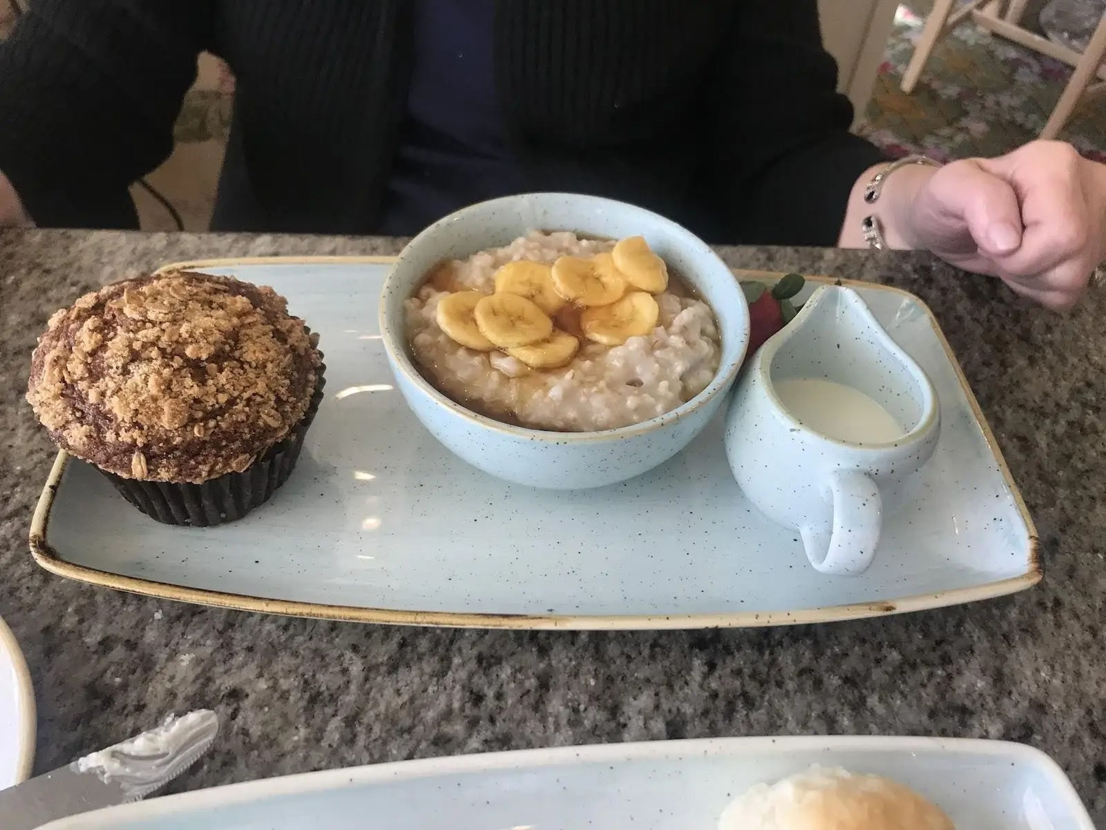 plate with a muffin and a bowl of oatmeal at the grand floridian cafe in disney world