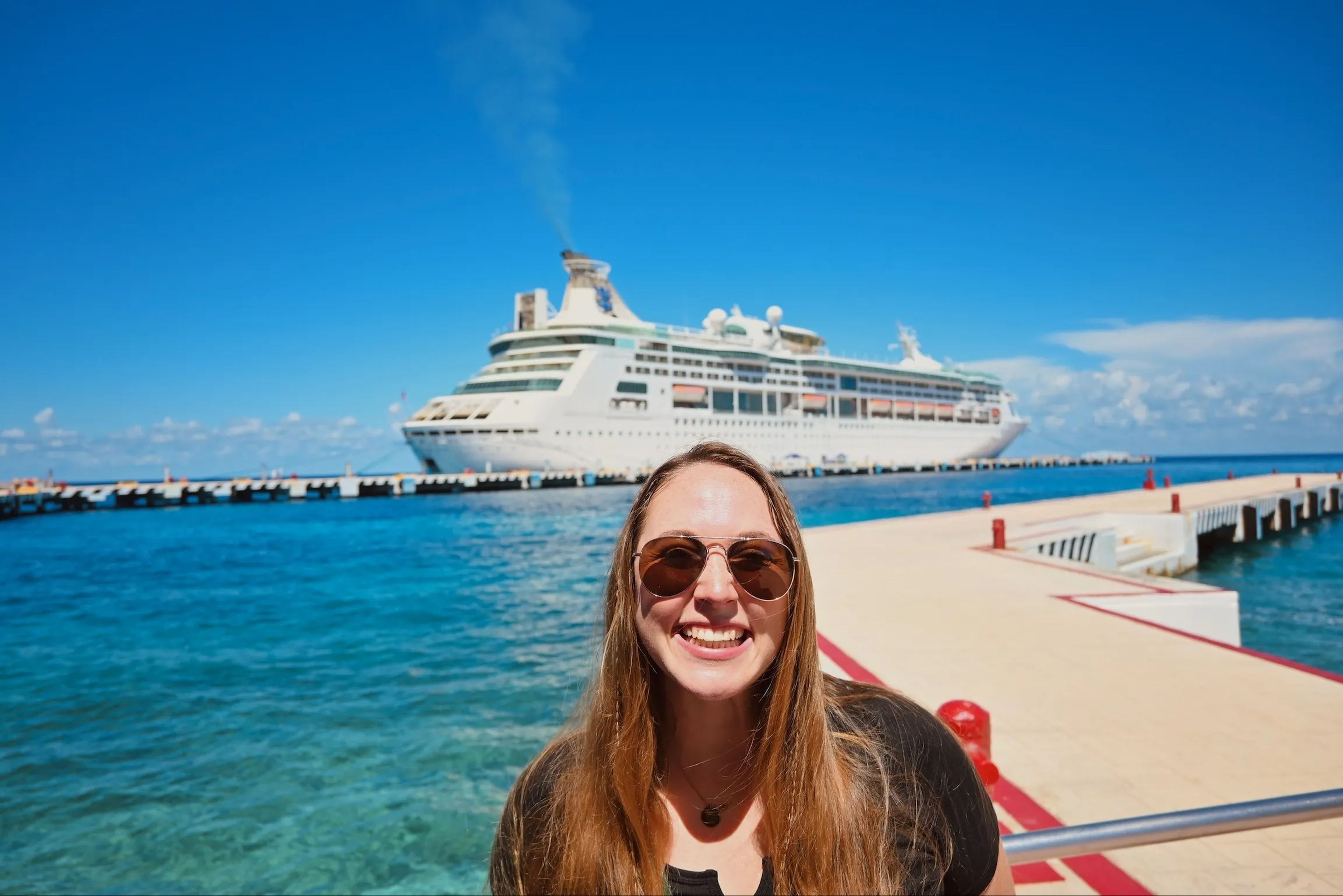 woman in front of cruise ship