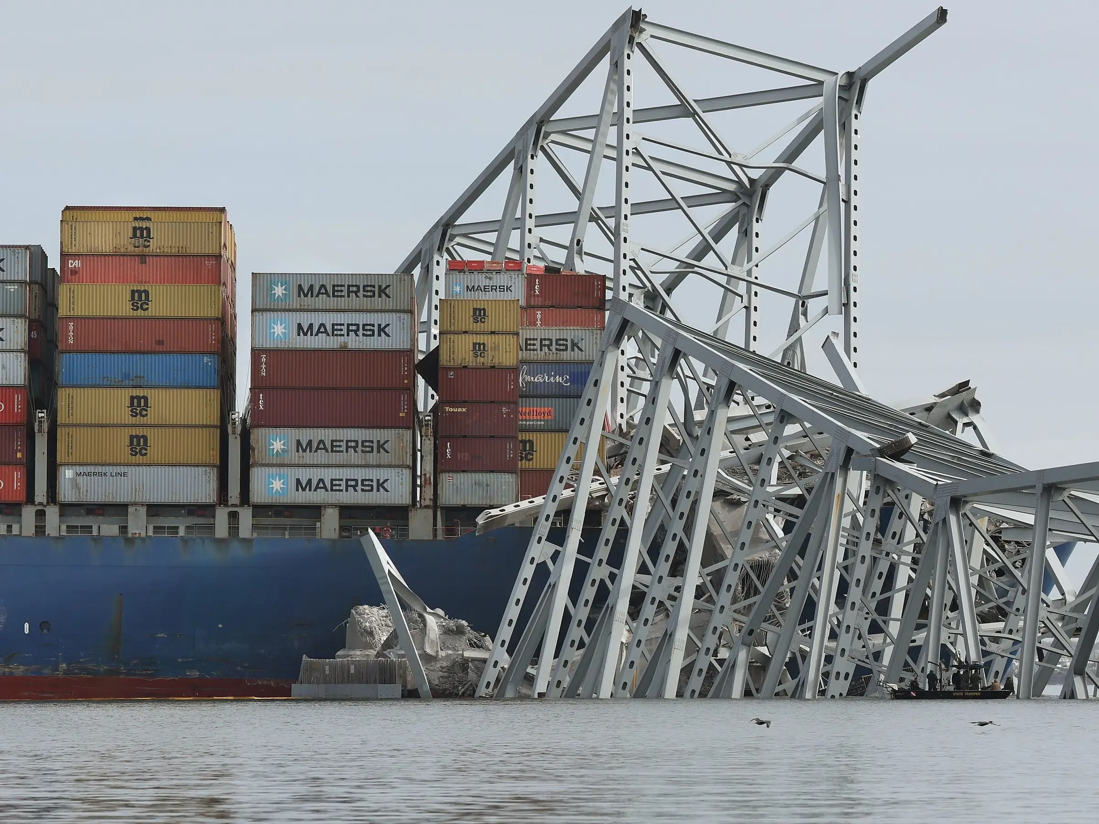 The cargo ship Dali sits in the water after running into and collapsing the Francis Scott Key Bridge.