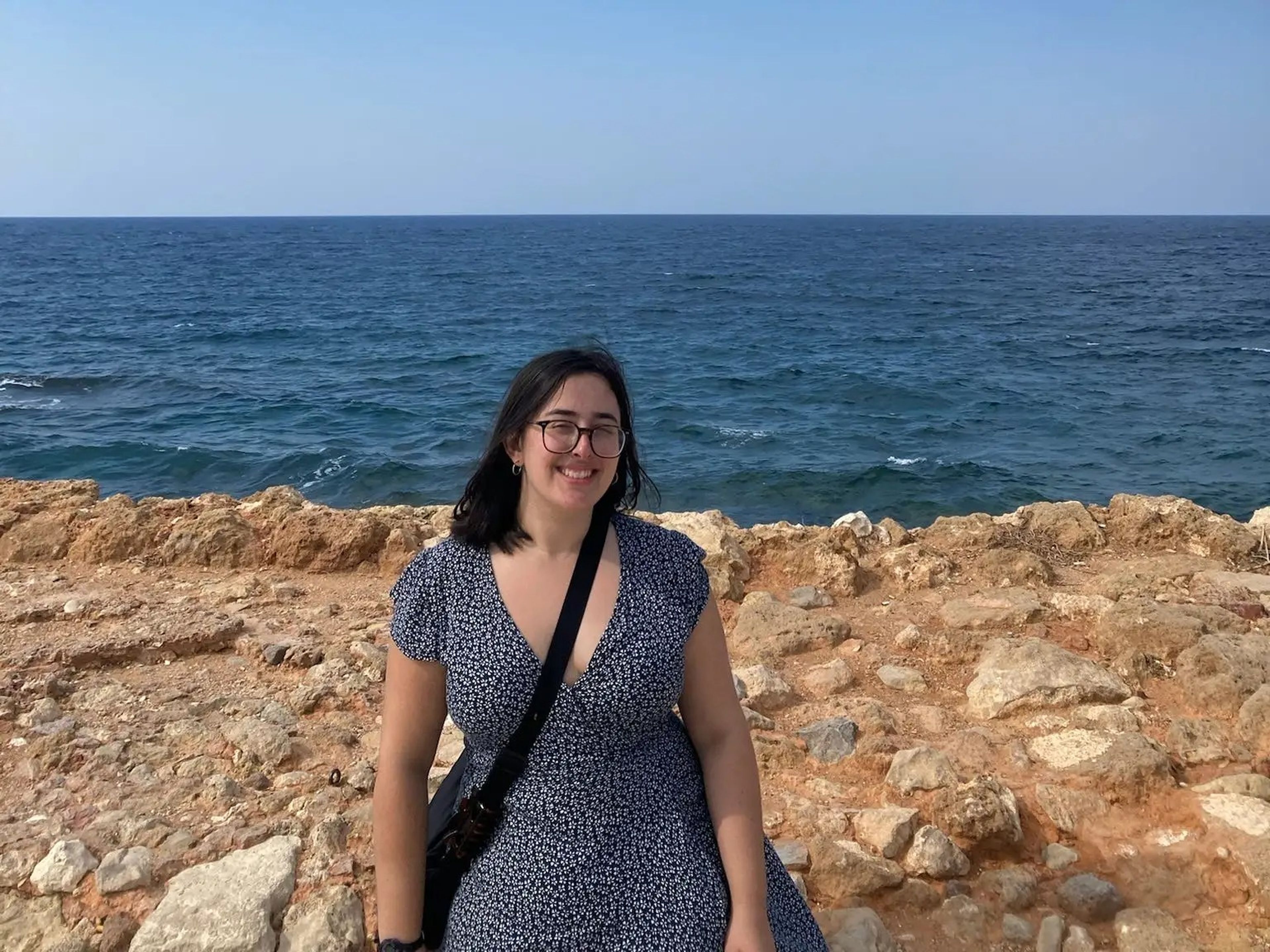 hannah posing next to the ocean in create greece