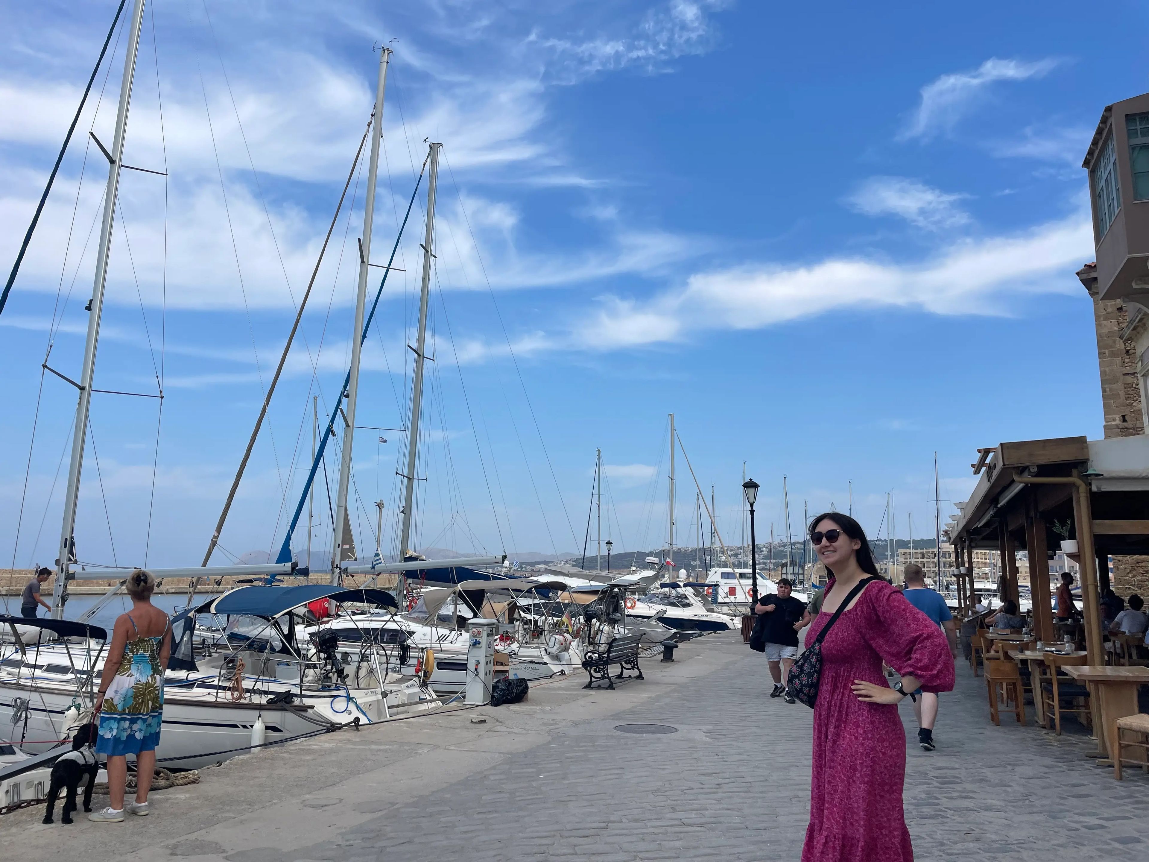 hannah posing for a photo in chania harbor in create greece