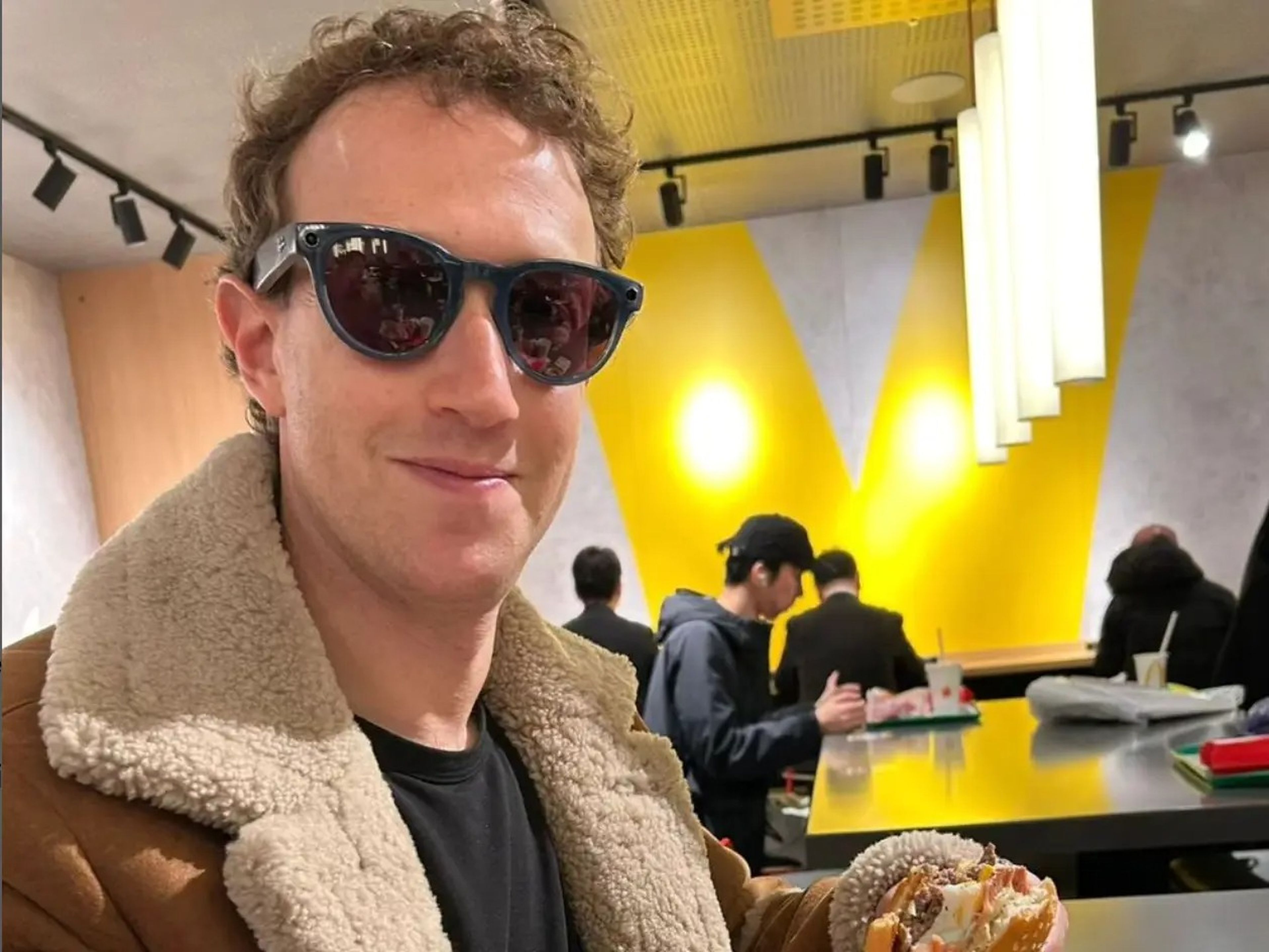 Mark Zuckerberg eating a burger at a Japanese McDonald's