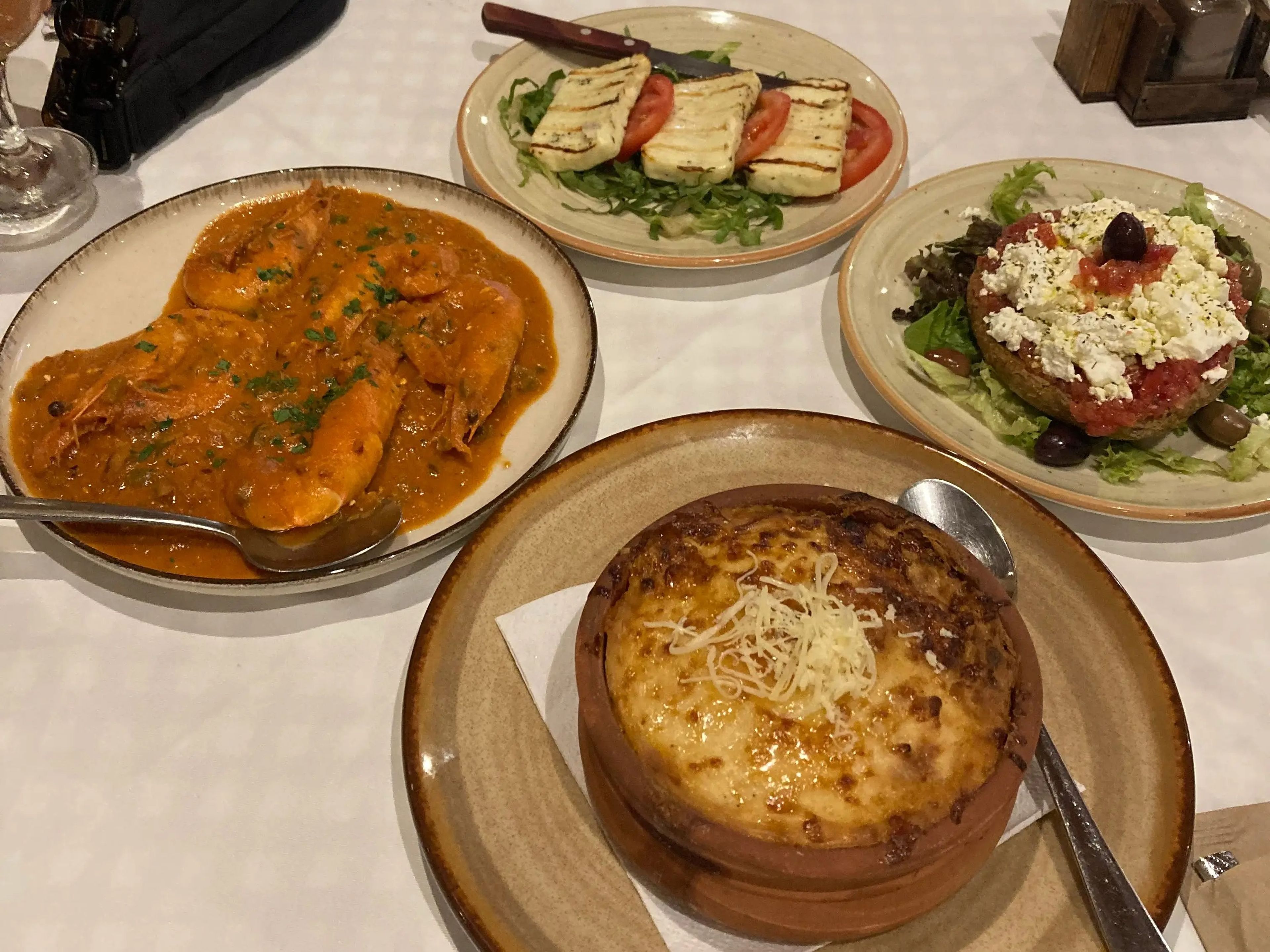 plates of greek food at a restaurant in crete