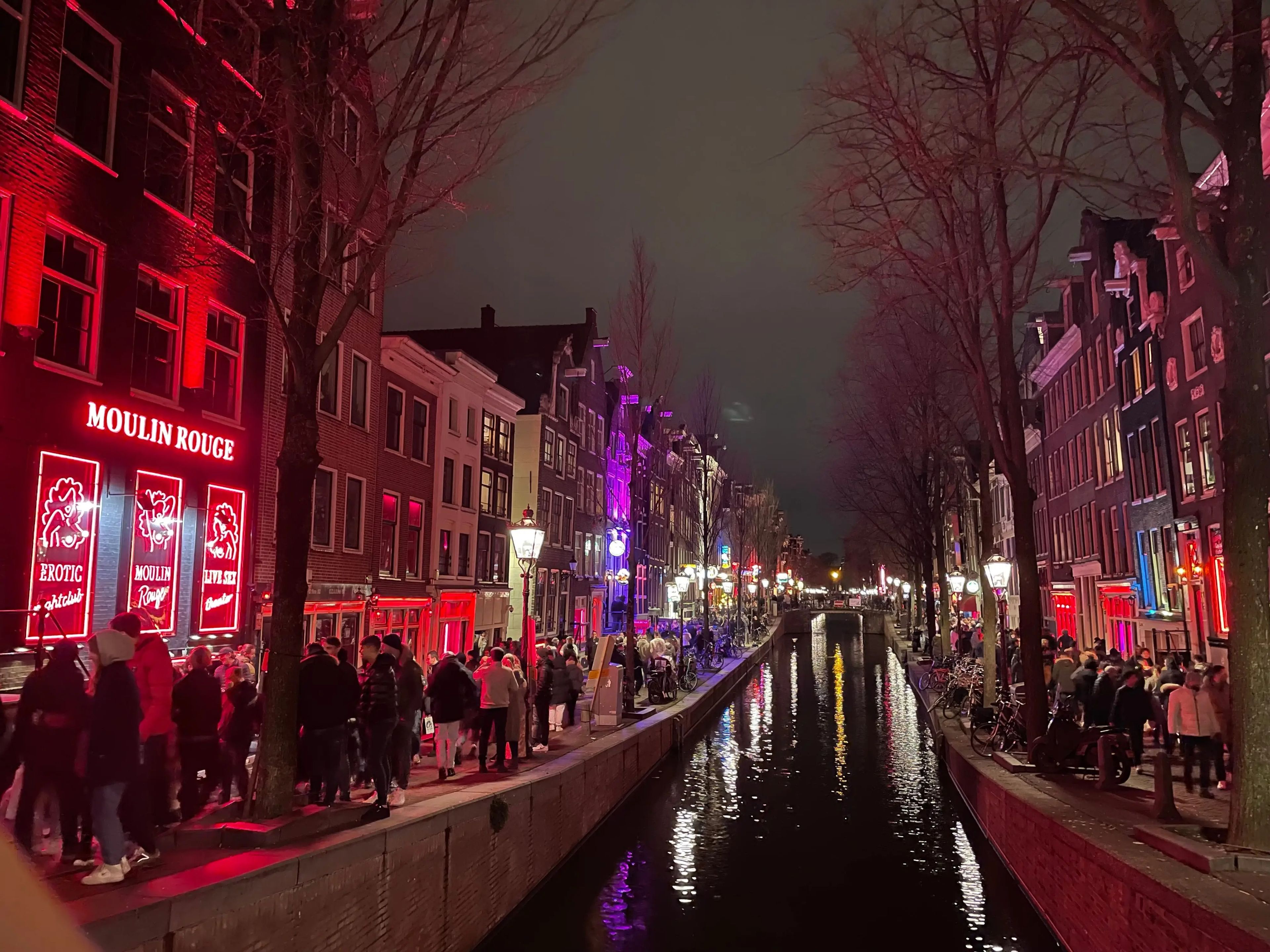 shot of the red light district in amsterdam at night