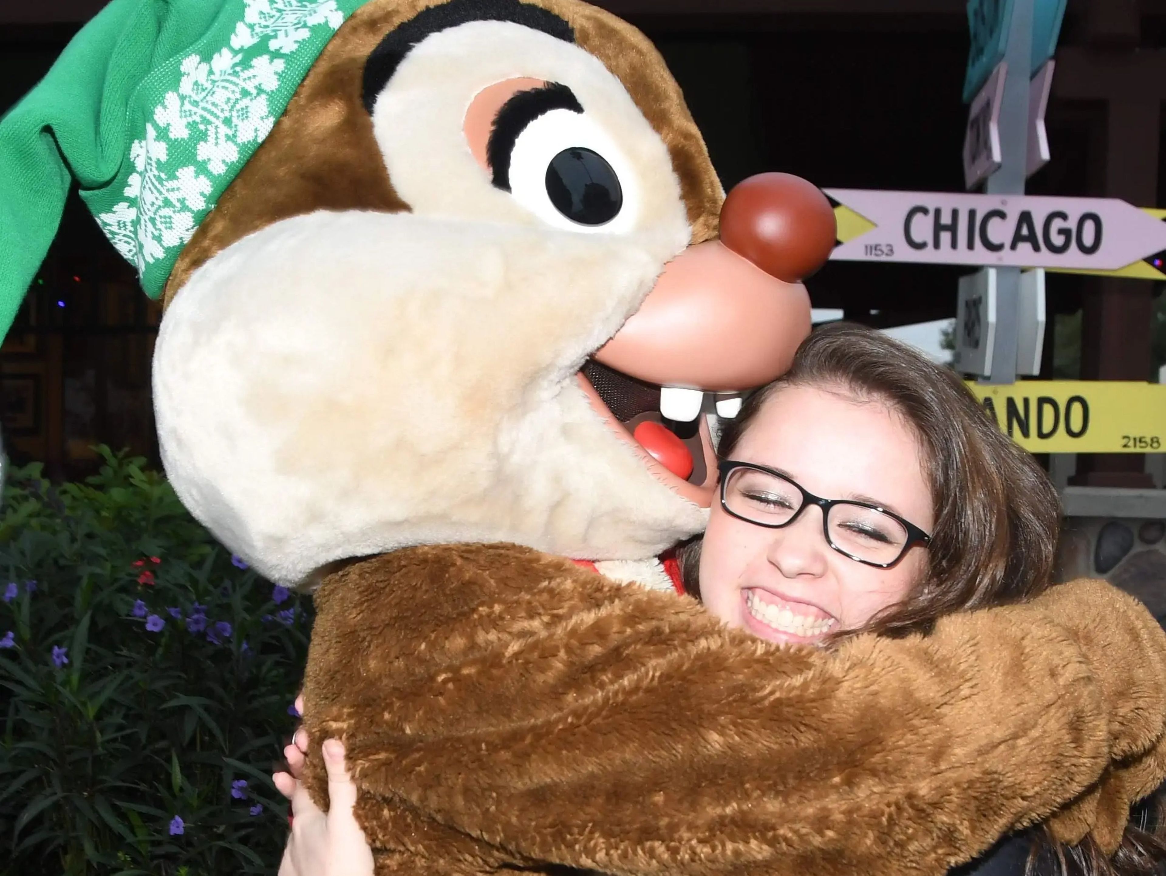 sofia posing for a photo hugging dale at hollywood studios in disney world
