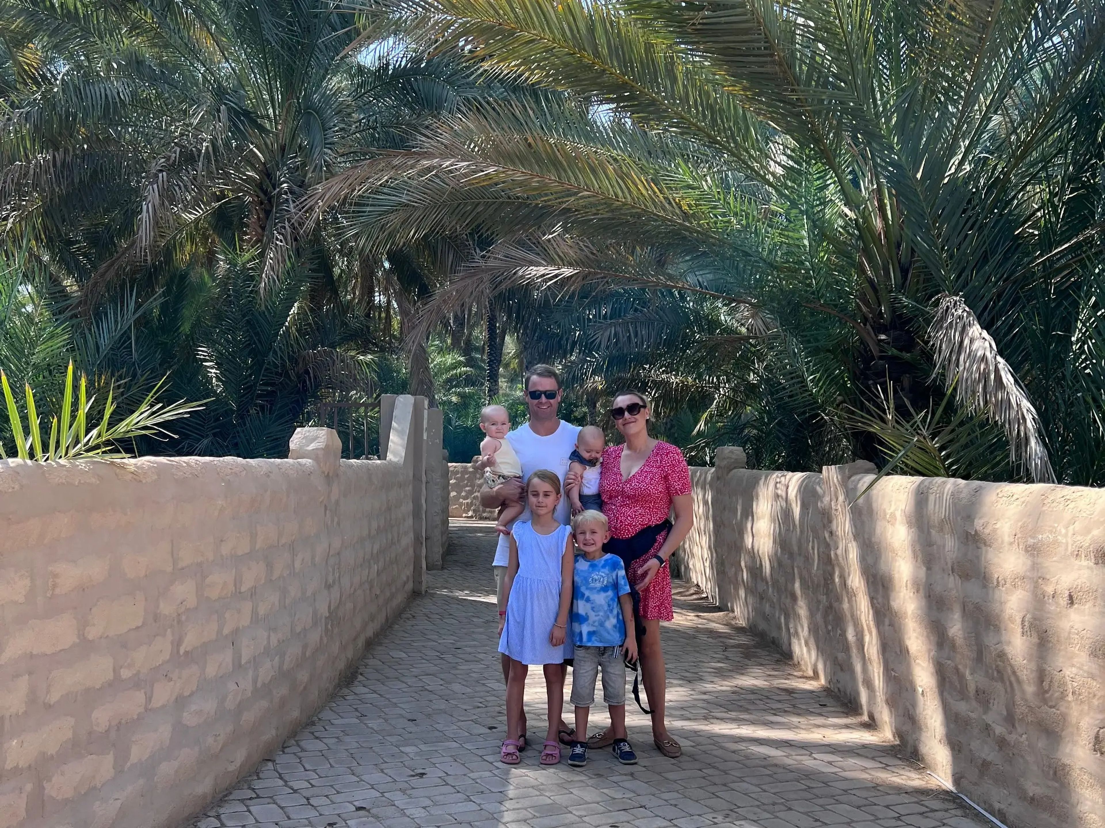 Karen Edwards, her husband and children at the Al Ain Oasis.