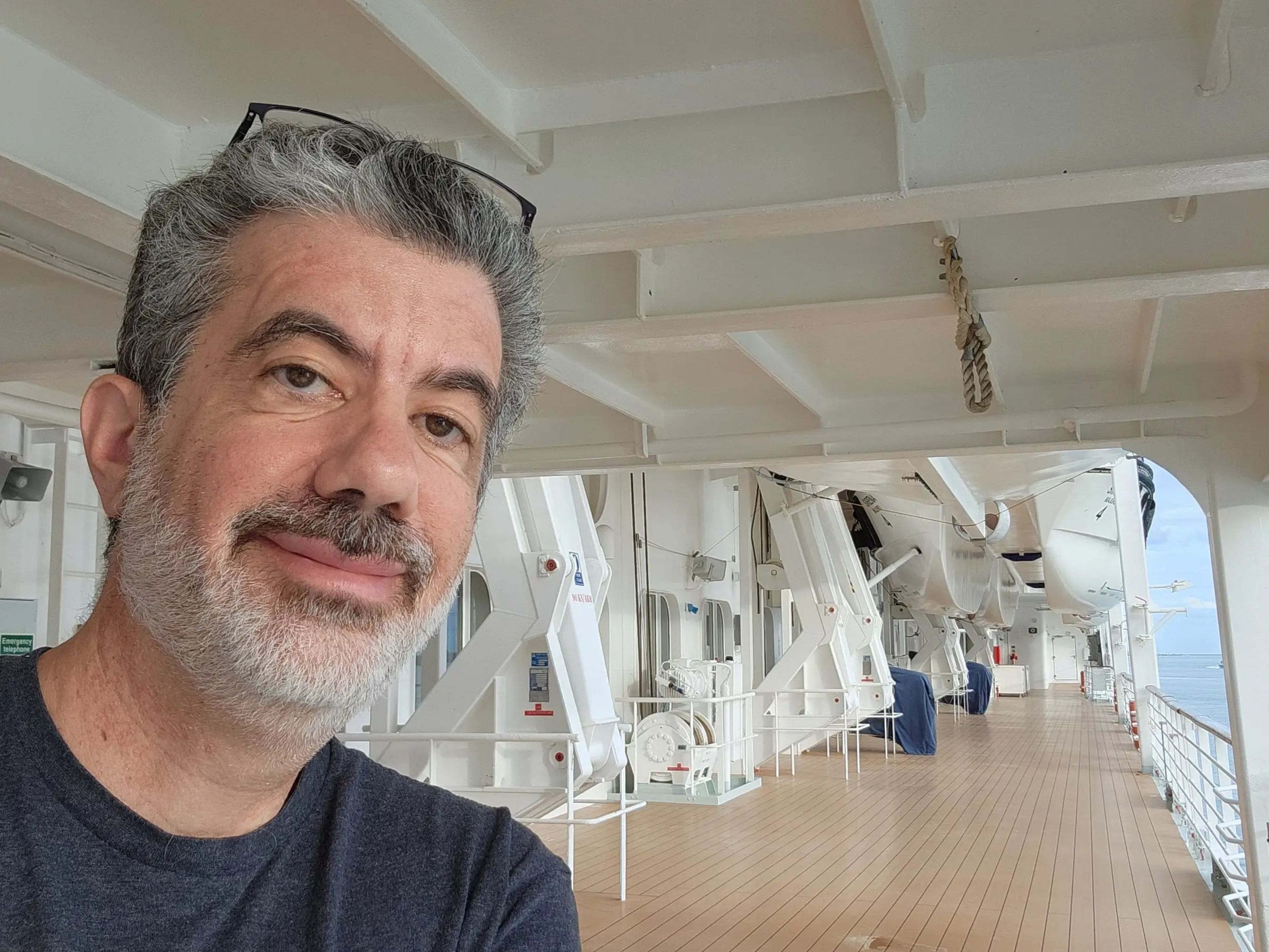 a man takes a selfie on a cruise ship