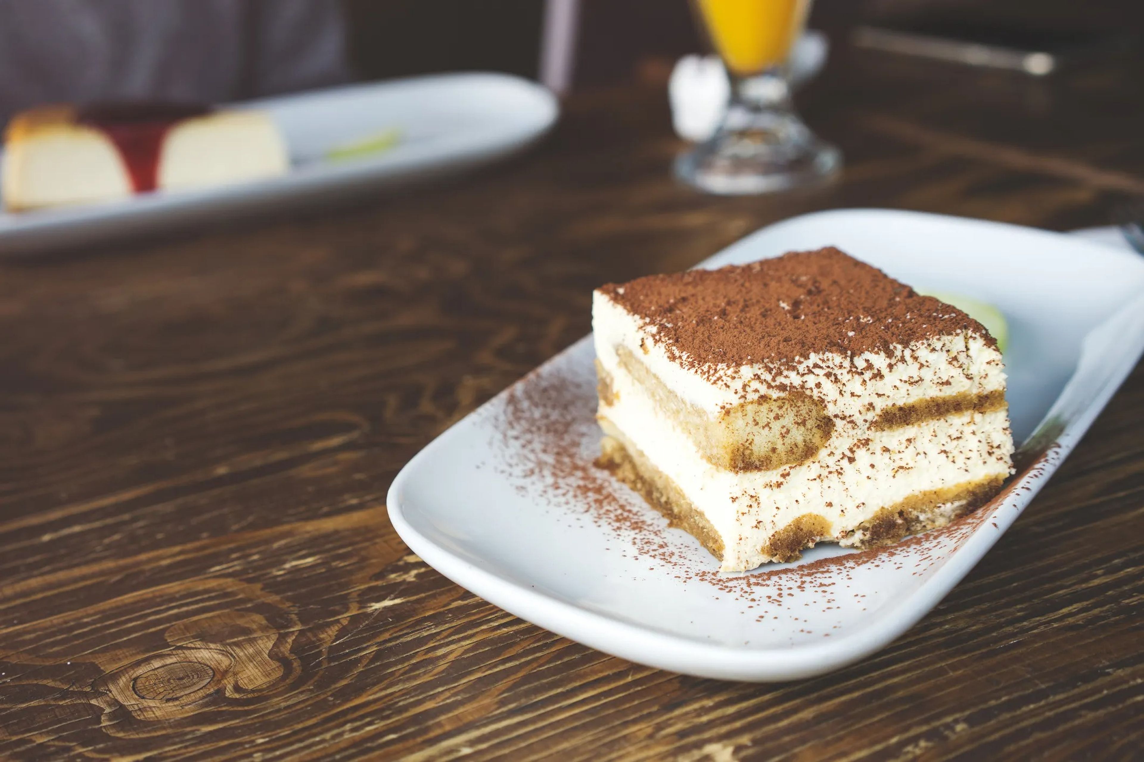 A stock image shows a plate of tiramisu, which typically contains mascarpone — an Italian cream cheese.