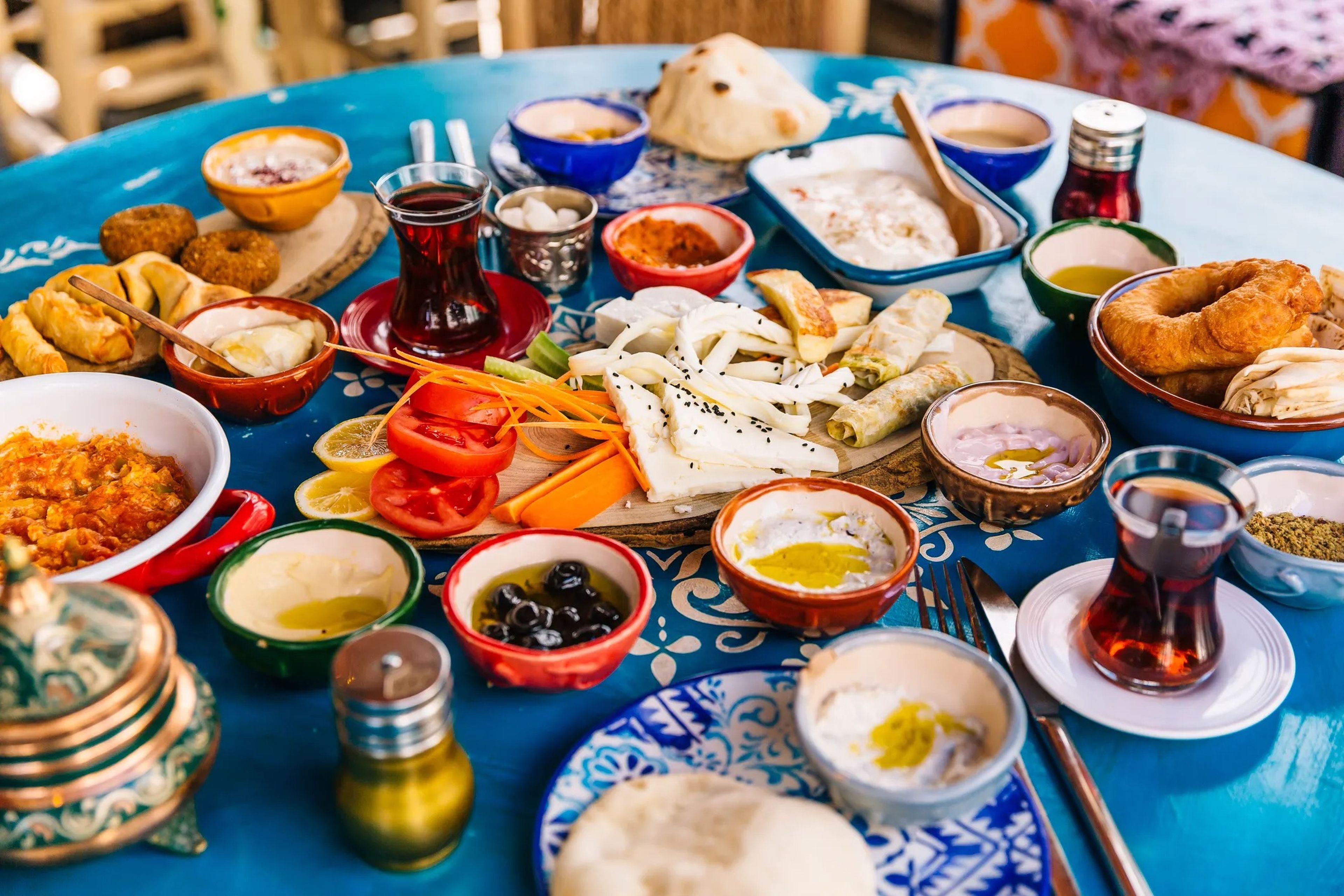 Greek food spread on blue table
