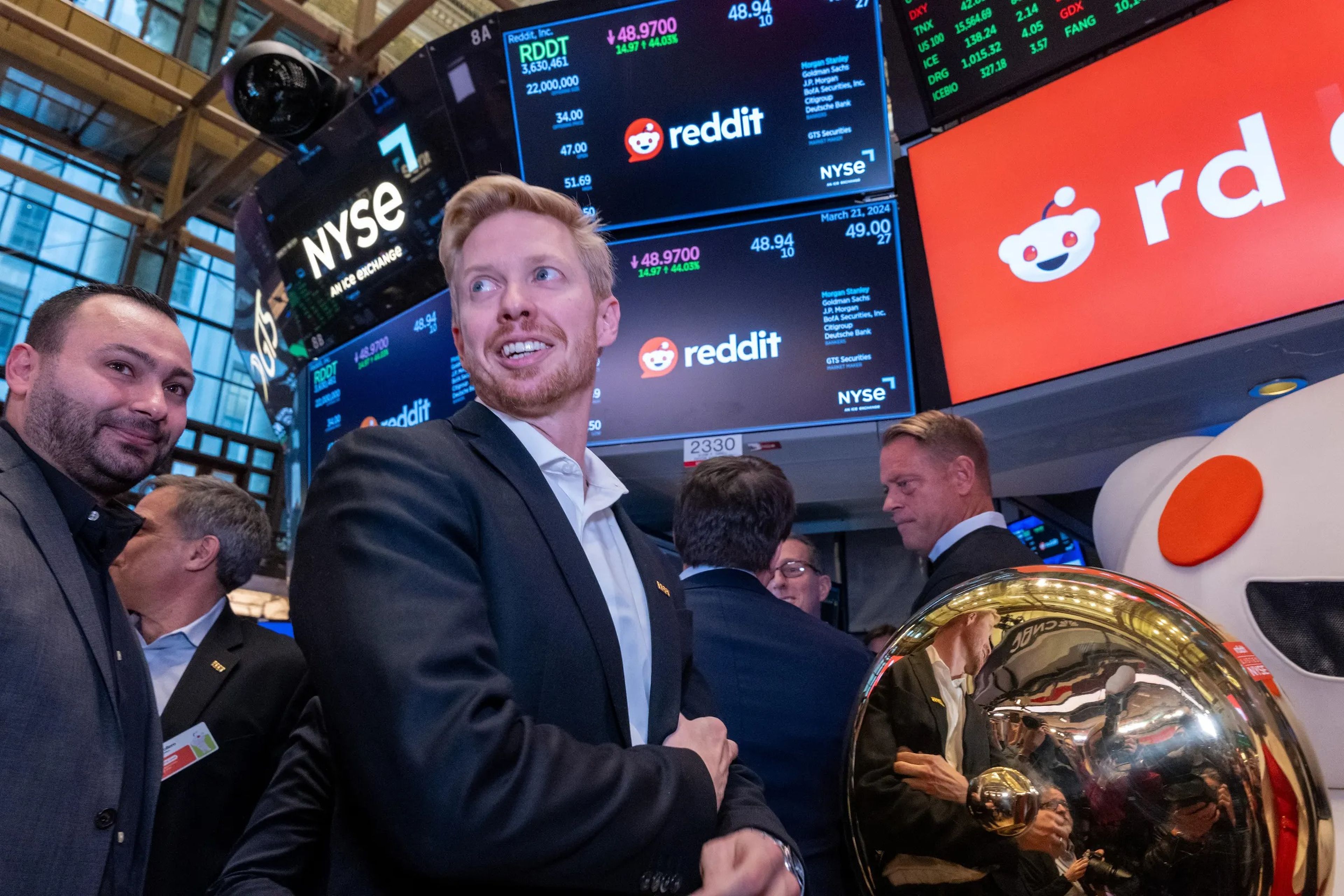 Reddit CEO Steve Huffman stands on the floor of the New York Stock Exchange after ringing a bell setting the share price at $47 in its initial public offering on March 21, 2024 in New York City.